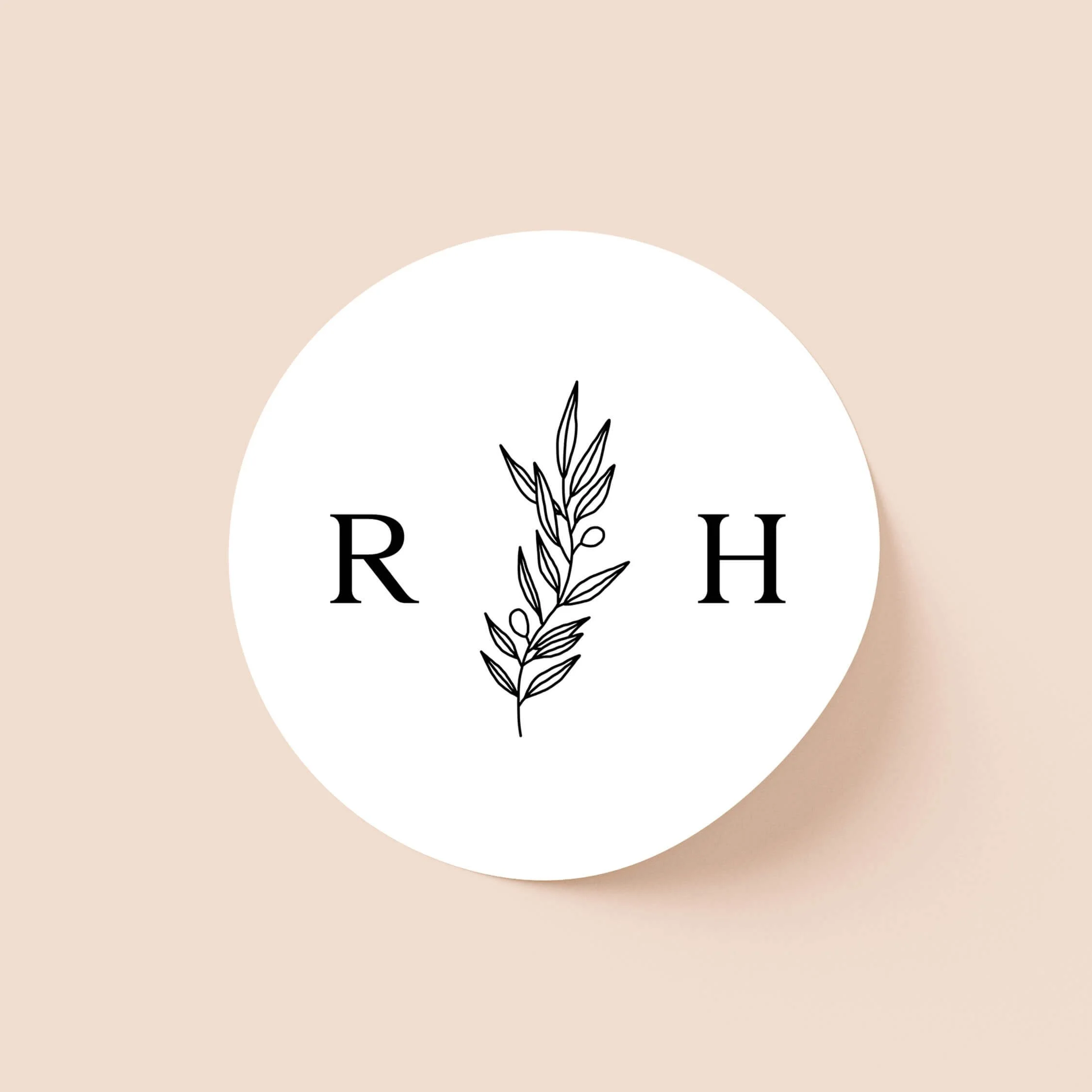 Heritage personalised wedding sticker with minimalist serif initials and botanical foliage detail on round sticker