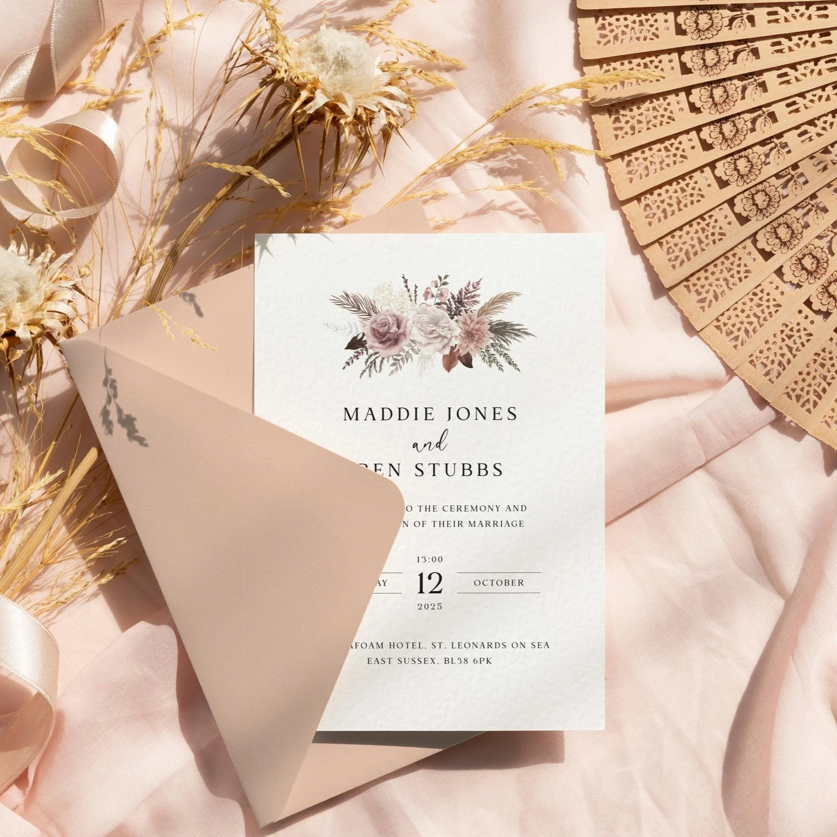 Blush Boho wedding invitation featuring a dusty pink floral bouquet at the top, perfect for romantic, rustic, or modern wedding themes.
