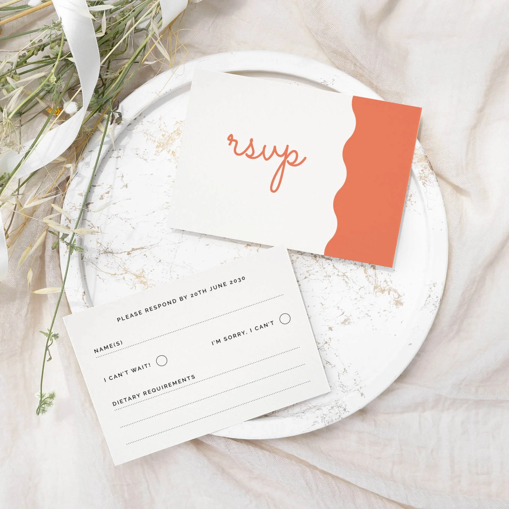 Scallop wedding RSVP card with a pastel orange scallop wave design and script typography on luxury off-white card