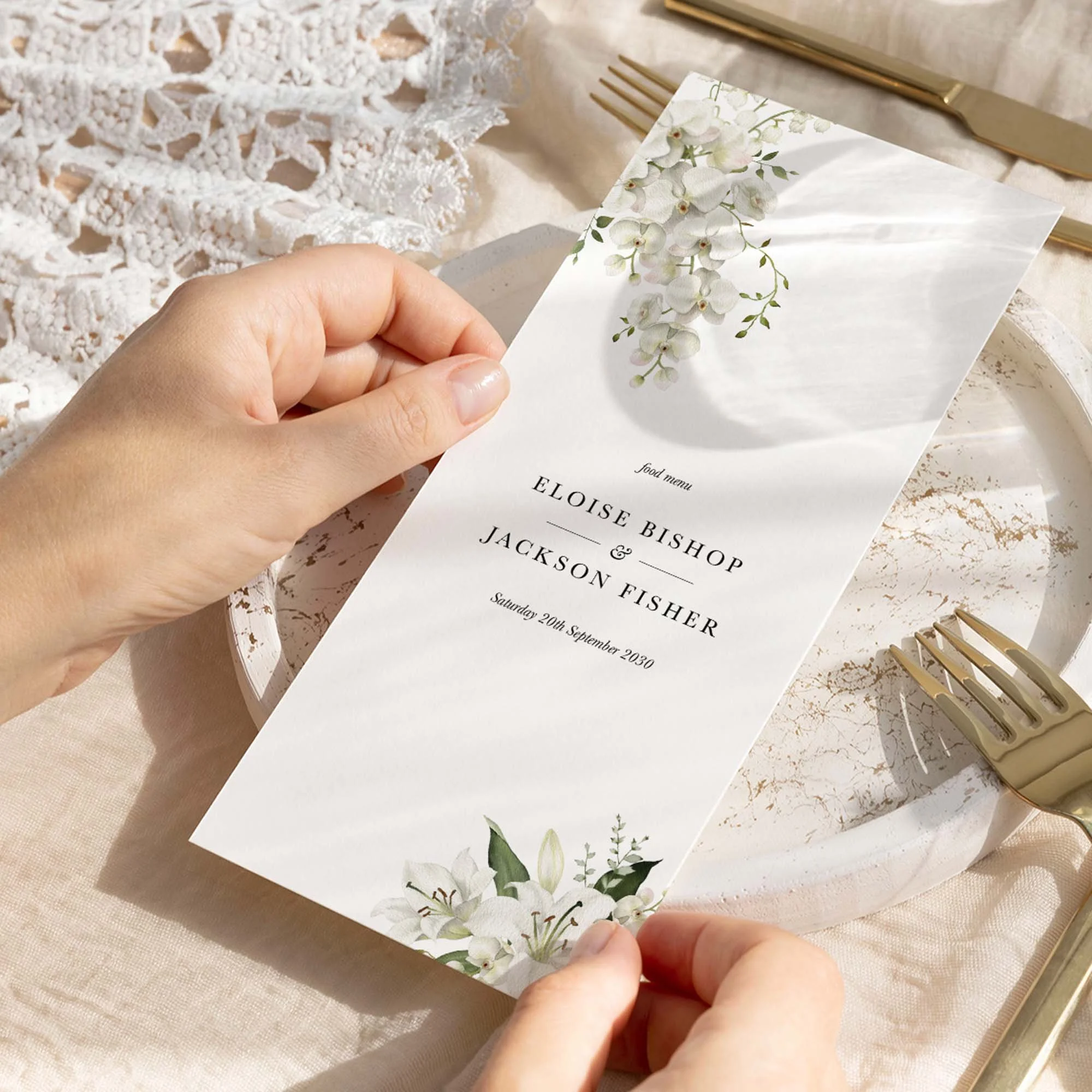Hand holding Garden wedding menu card showing size and printed design details