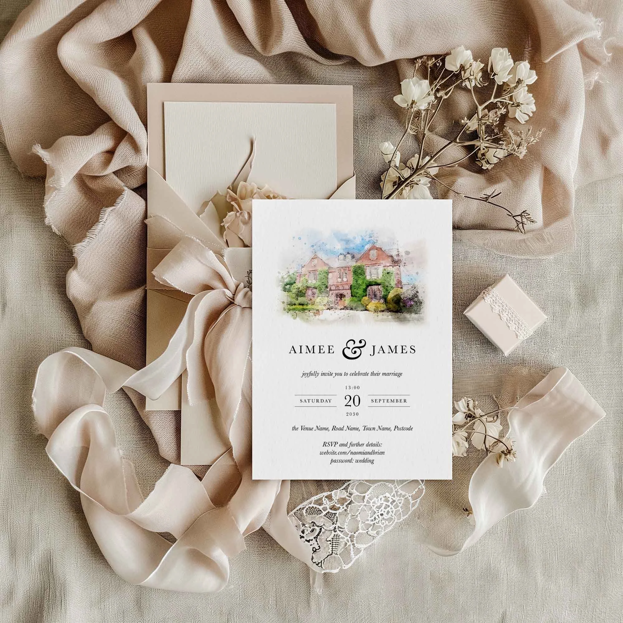 Watercolour wedding venue invitation styled with neutral silk ribbon, dried florals and luxury textured card stock.