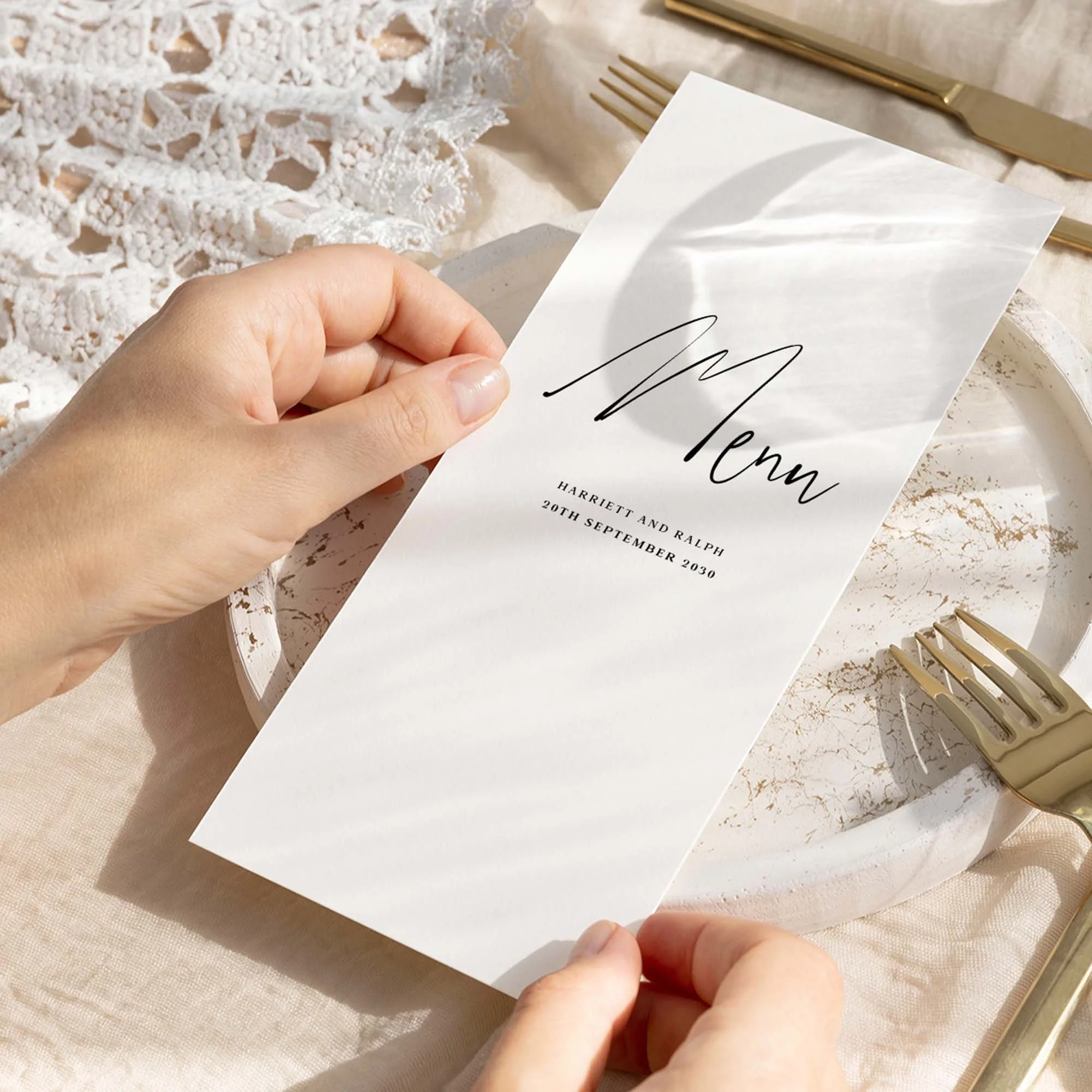 Hand holding Autograph wedding menu card showing size and printed design details