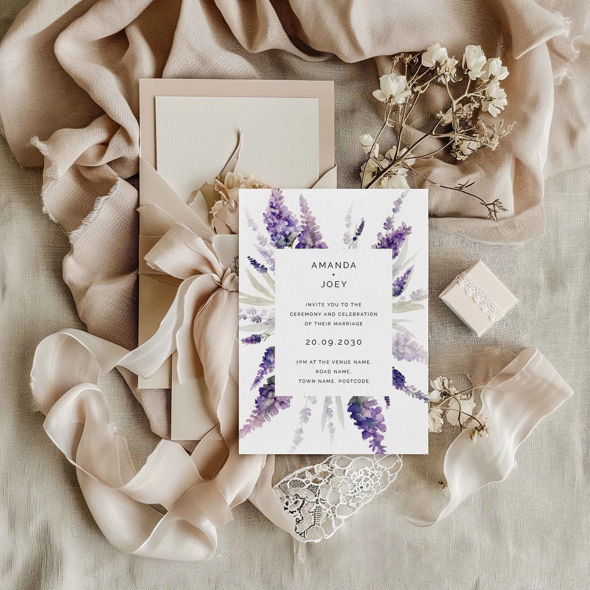 Lavender Frame wedding invitation styled in a flat lay environment with wedding props