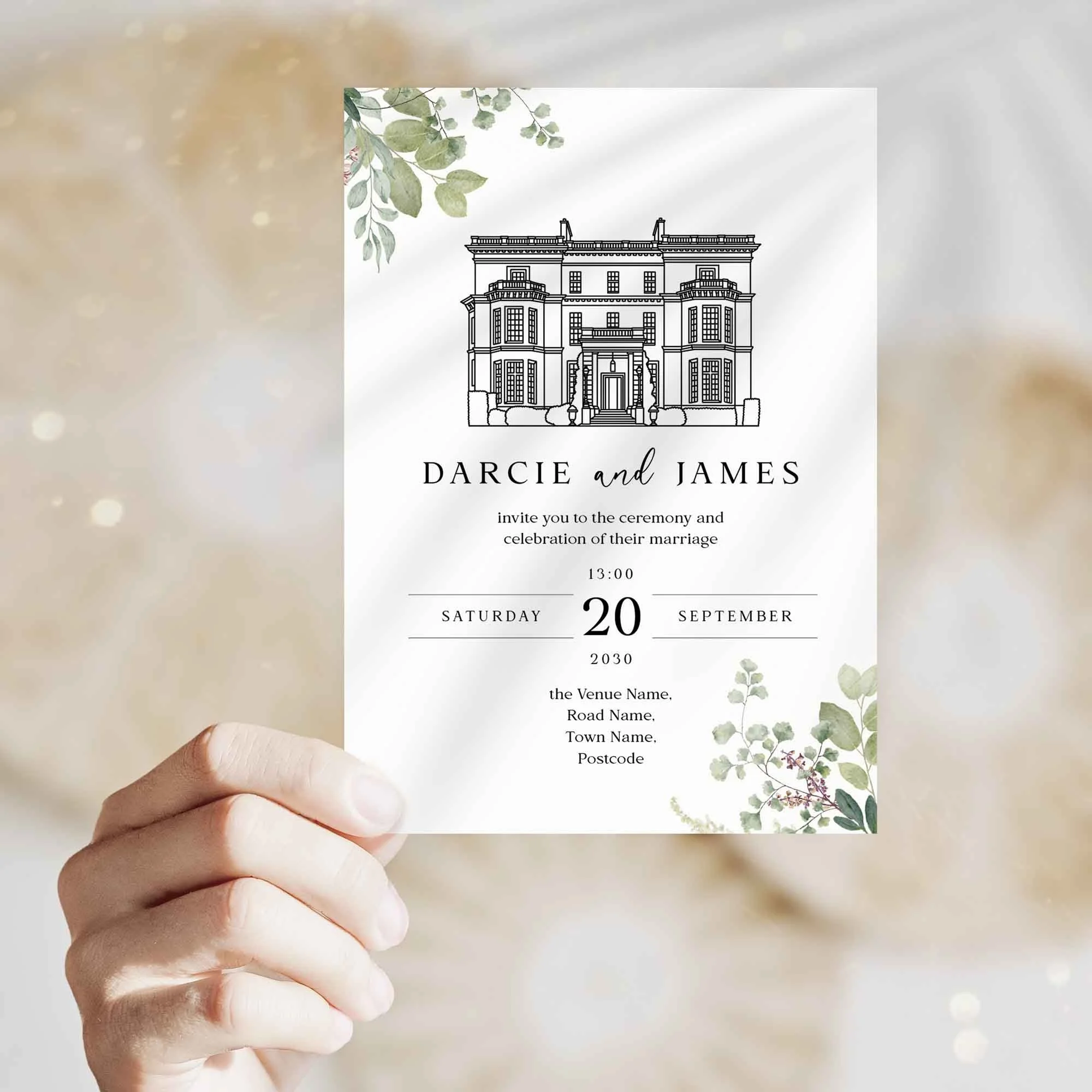 Hand holding Venue Greenery wedding invitation showing size and printed design details