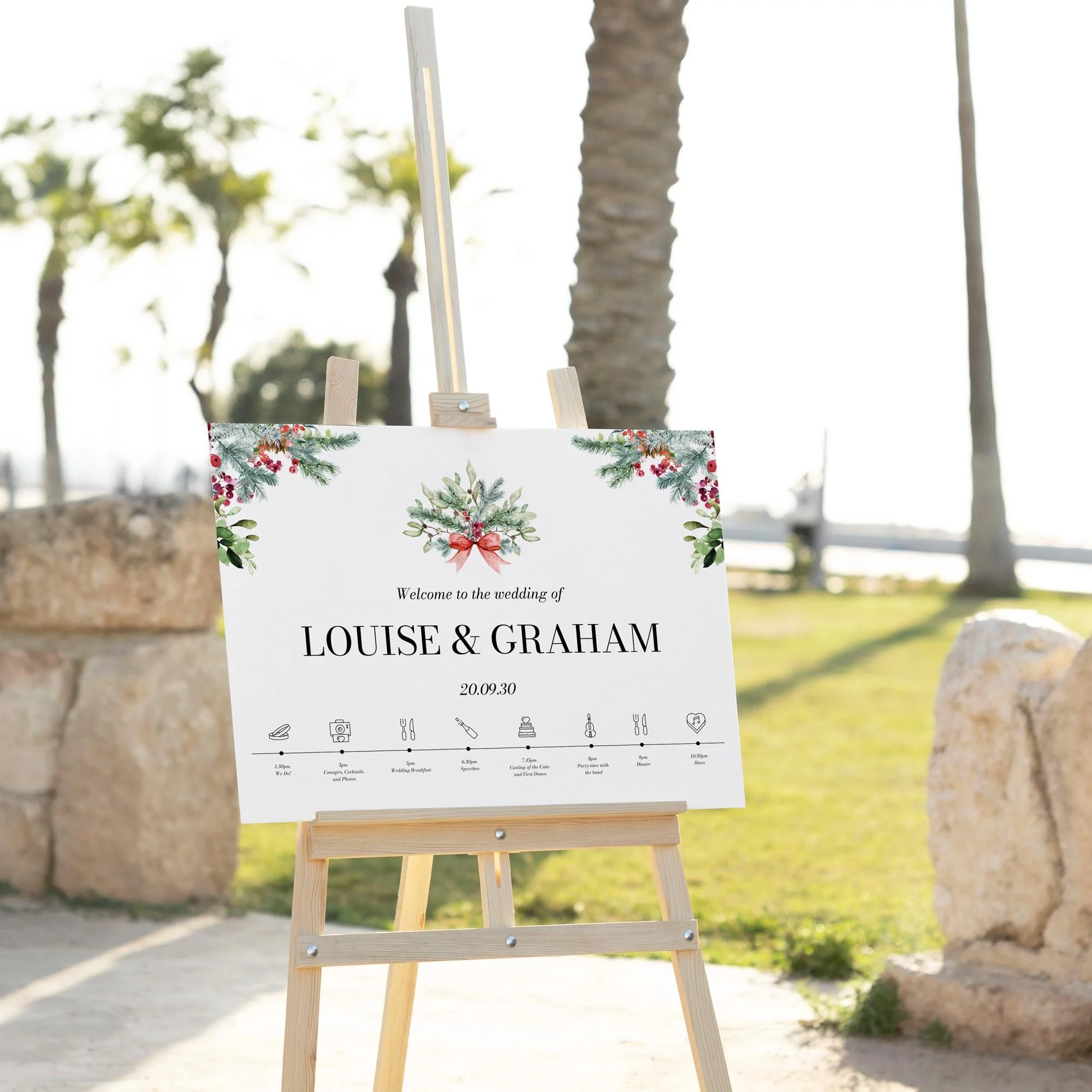 Winter Greenery Theme wedding welcome sign displayed outdoors at a wedding venue on an easel