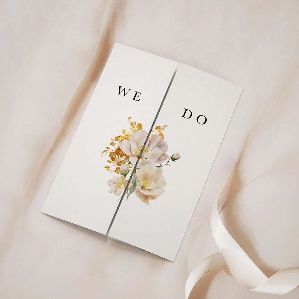Ethereal Collection gatefold wedding invitation closed, featuring sage green foliage, ivory florals, and gold leaves in a wide border design