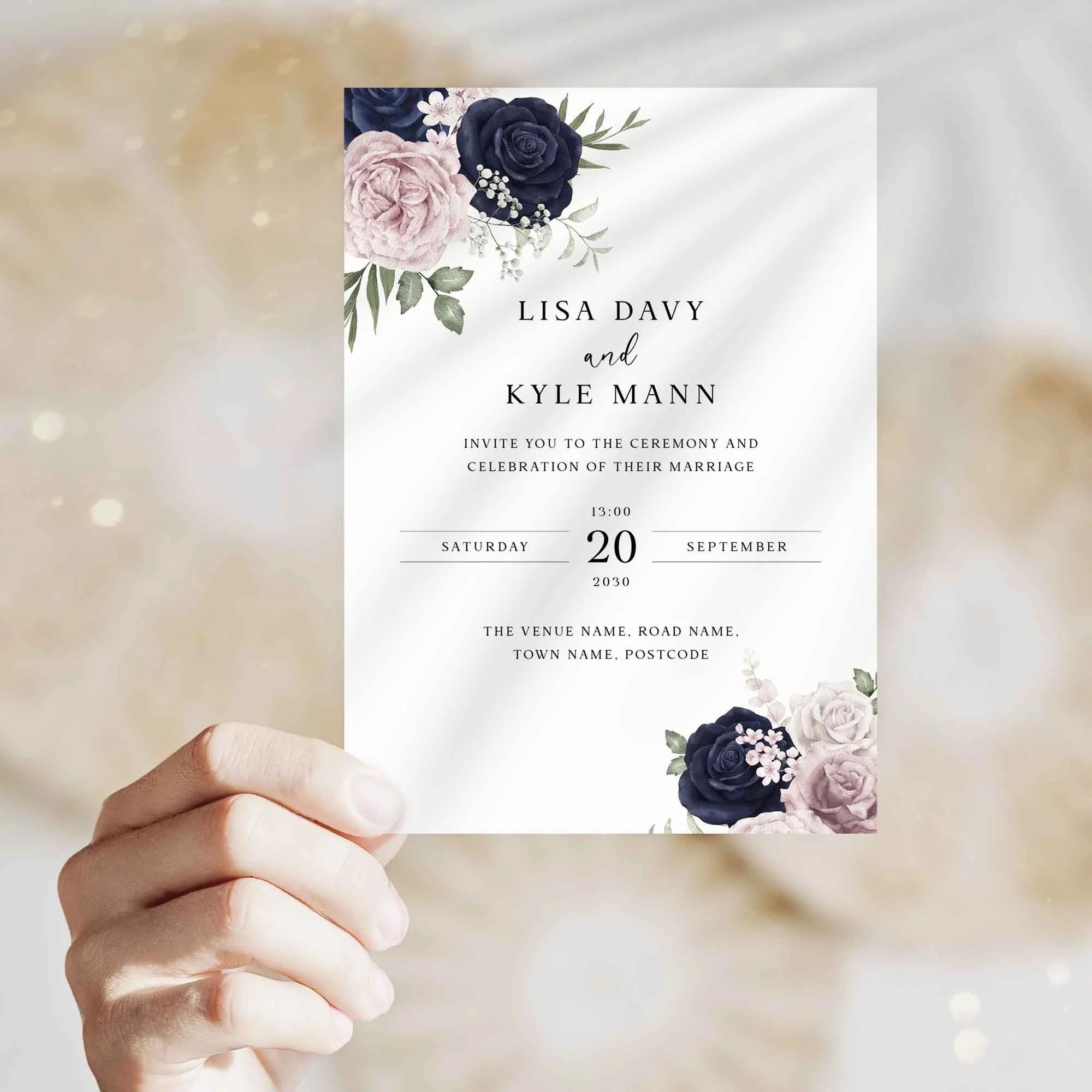 Hand holding Navy and Blush Floral wedding invitation showing size and printed design details