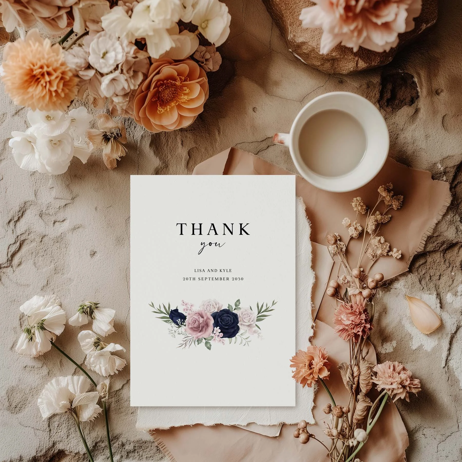 Blue and Pink Floral wedding thank you card styled with flowers and stationery details