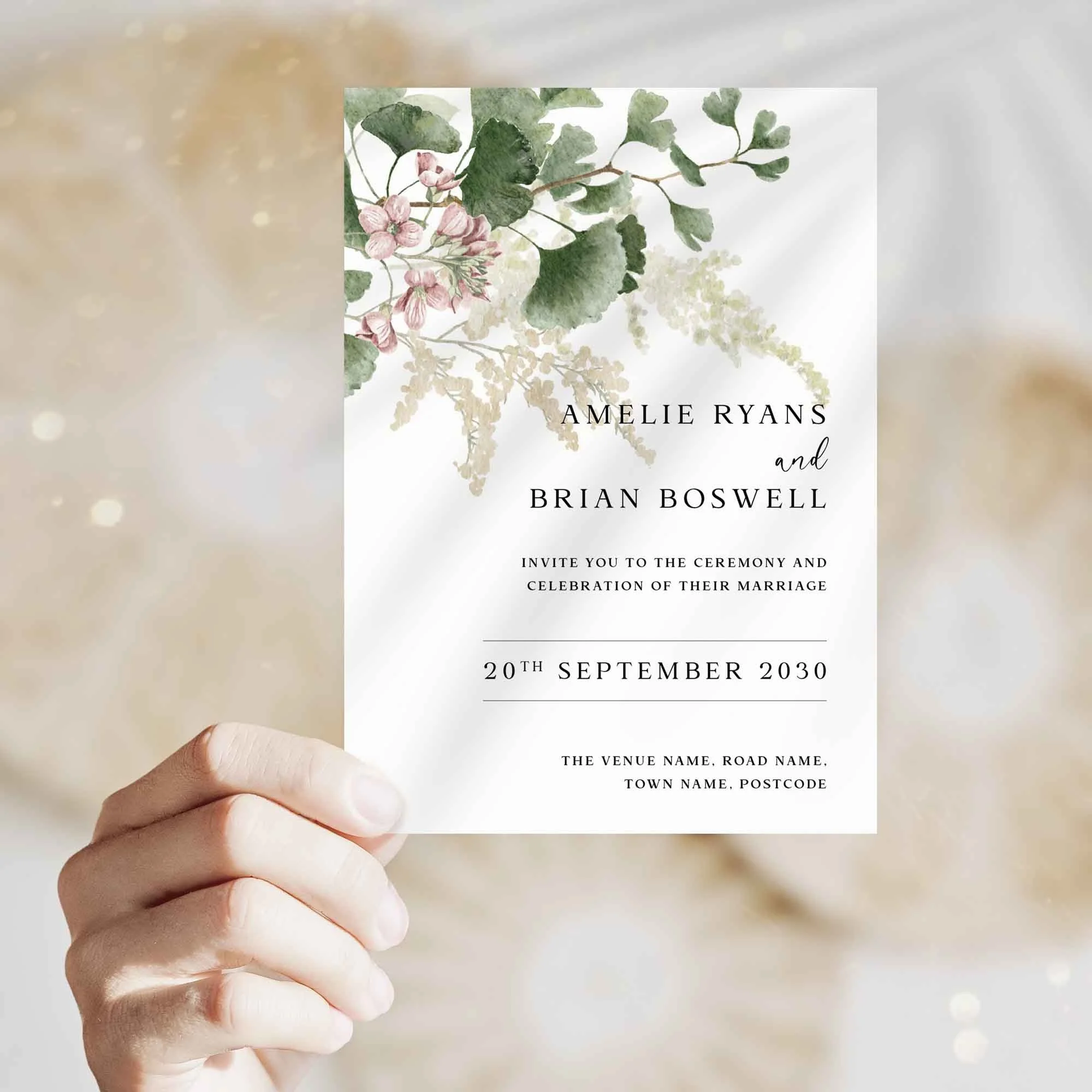 Hand holding Forest Leaves wedding invitation showing size and printed design details
