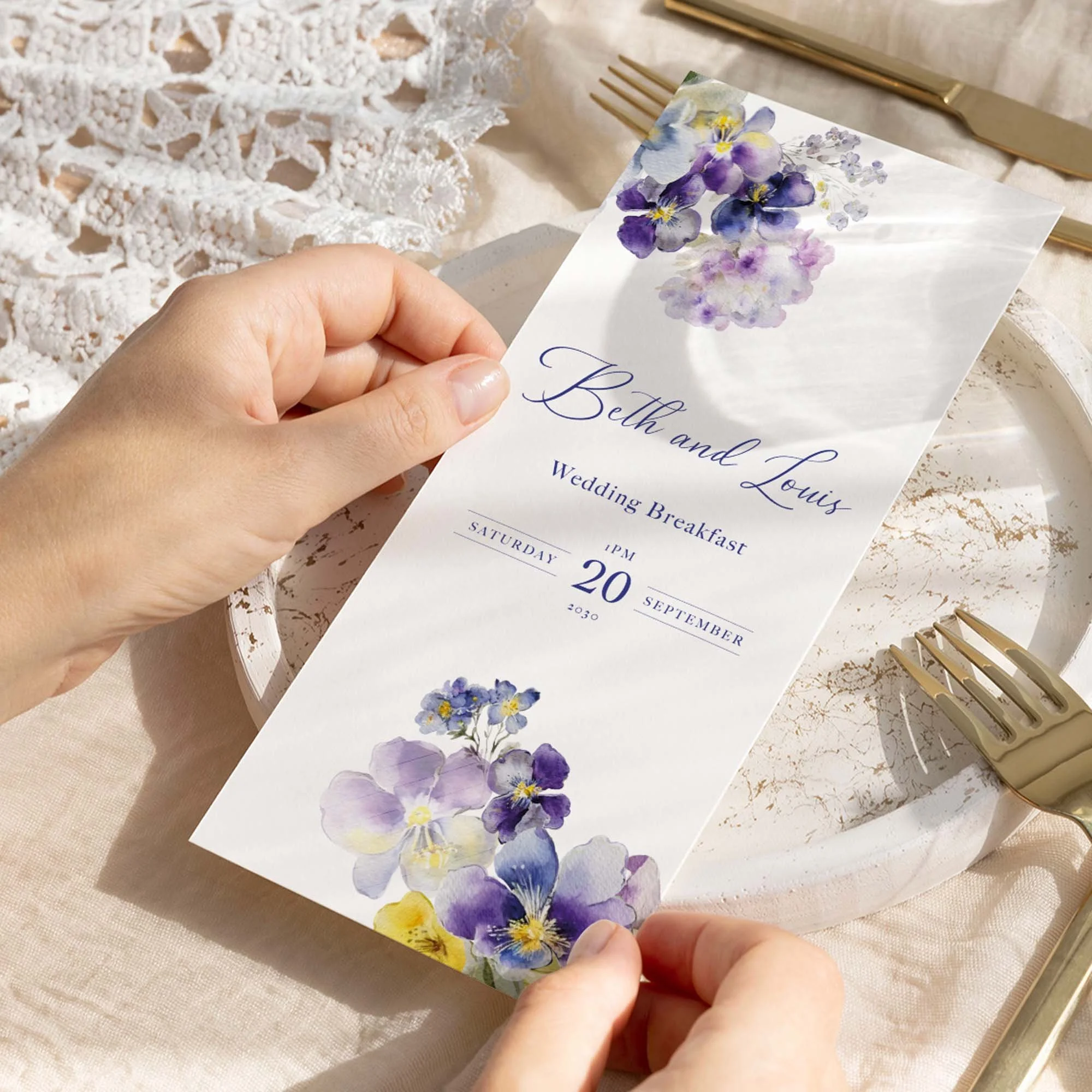 Hand holding Violets wedding menu card showing size and printed design details