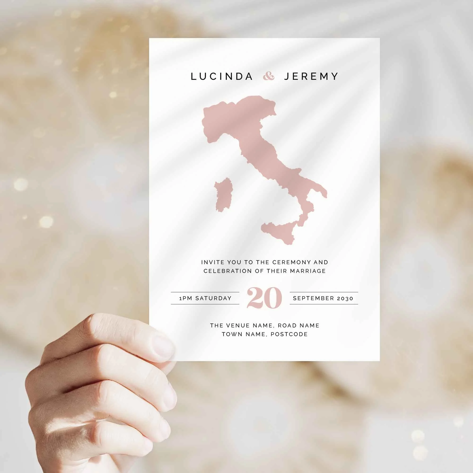 Hand holding Travel wedding invitation showing size and printed design details