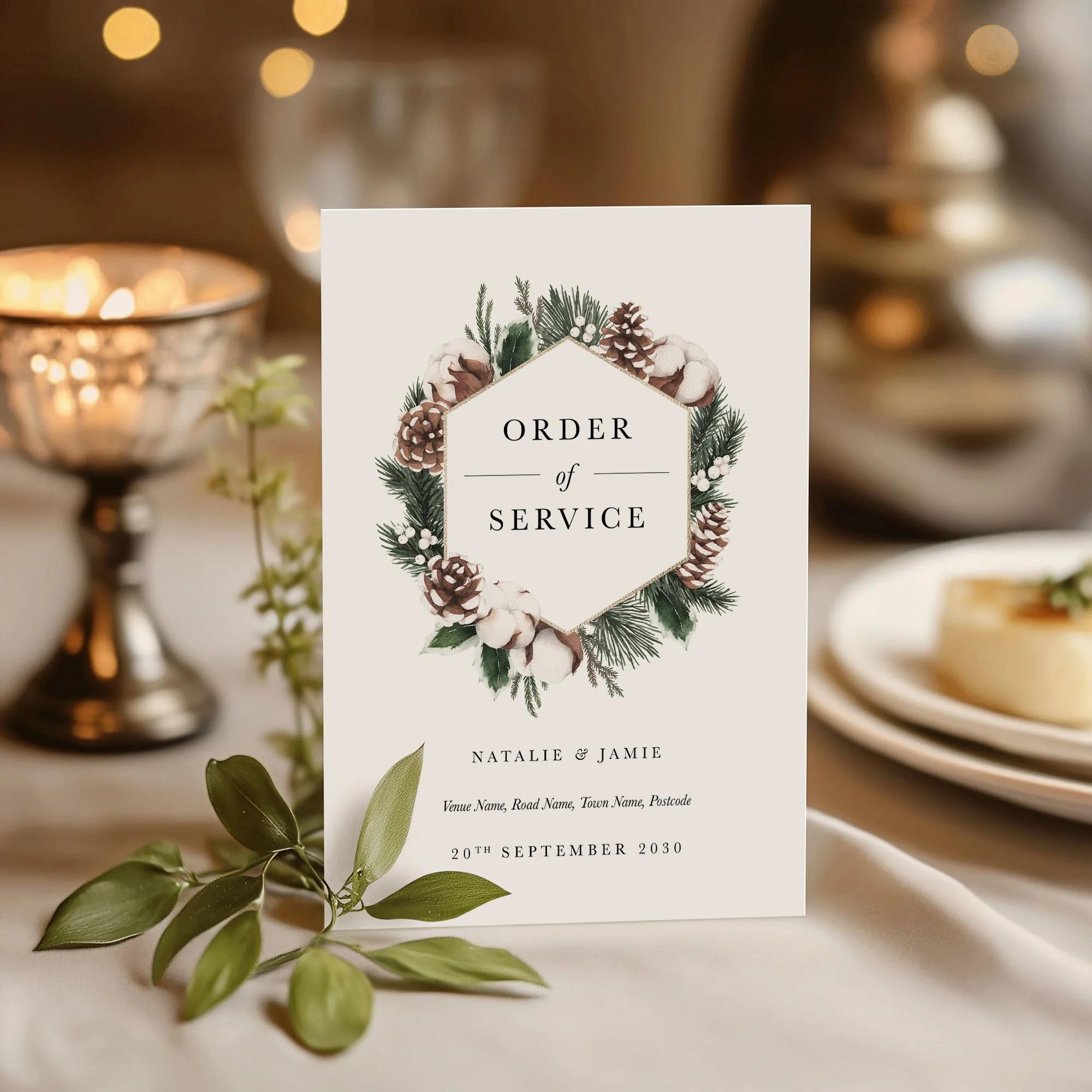 Pinecone and Winter Greenery wedding order of service on a wedding day displayed