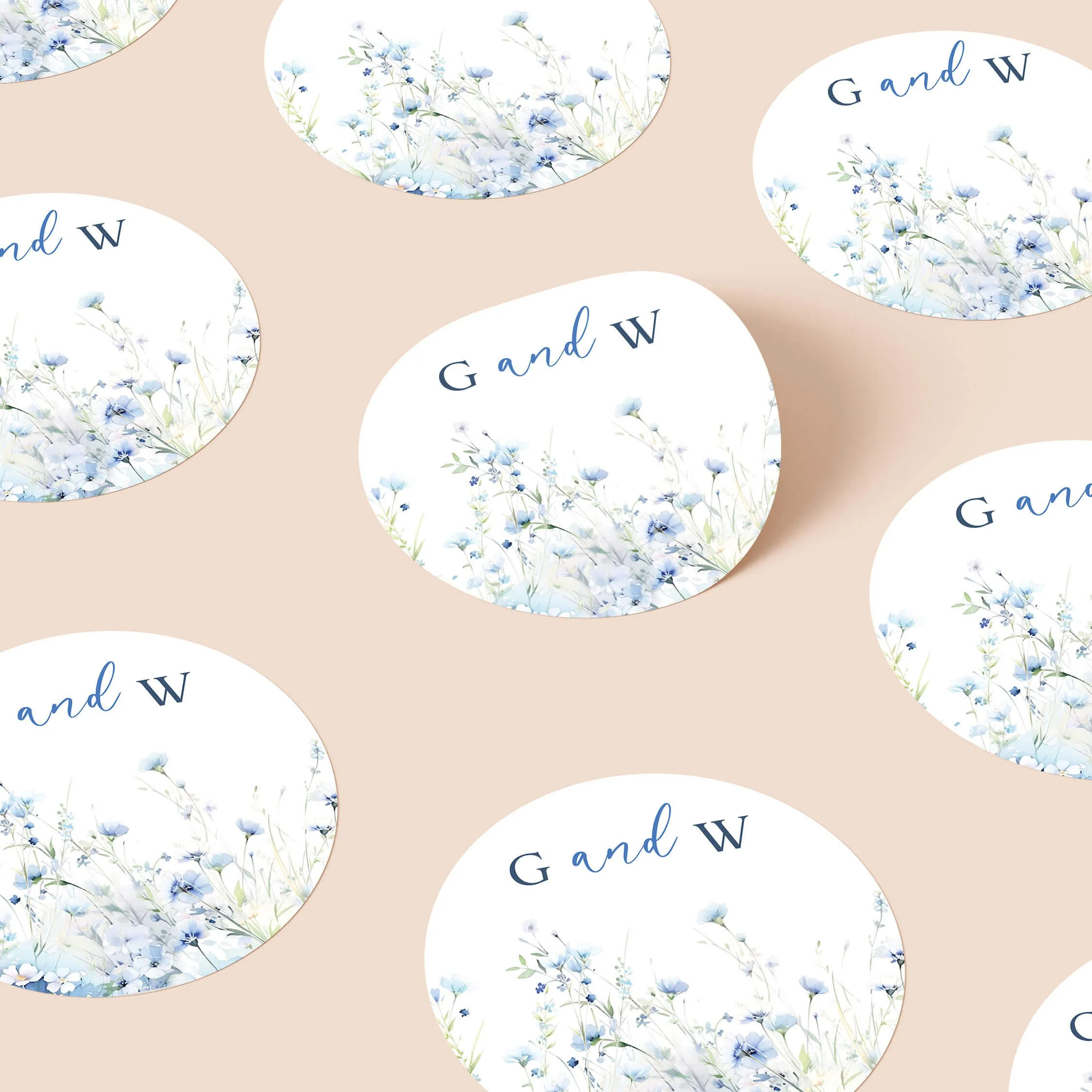 Field Dusty Blue wedding stickers with soft blue wildflowers and initials repeated on personalised round seals