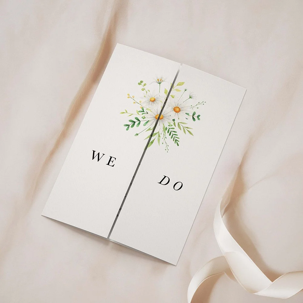 Daisy Collection gatefold invitation closed, featuring a central daisy bouquet and smaller side bouquets with soft yellow and green accents.