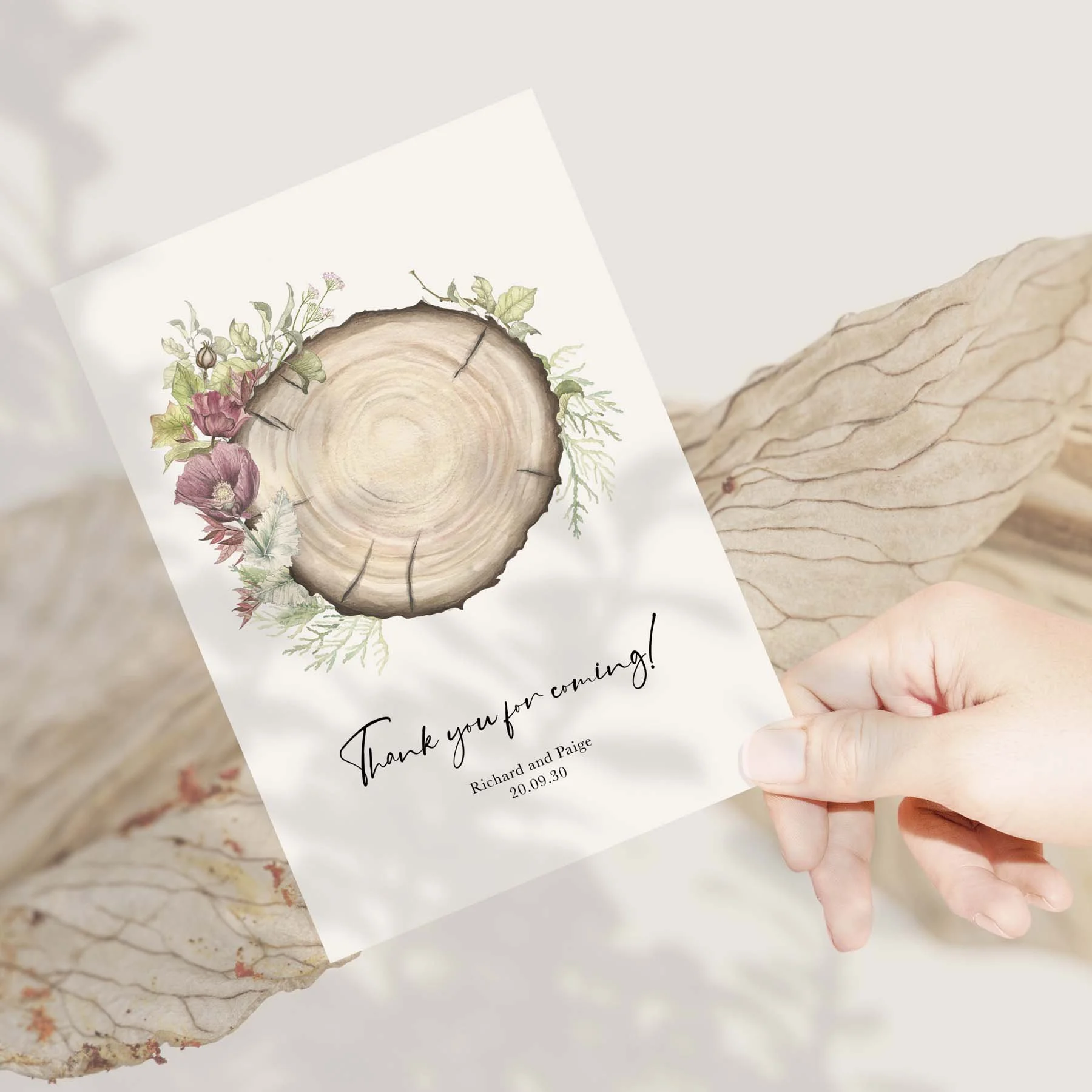 Hand holding a Wood Slice wedding thank you card