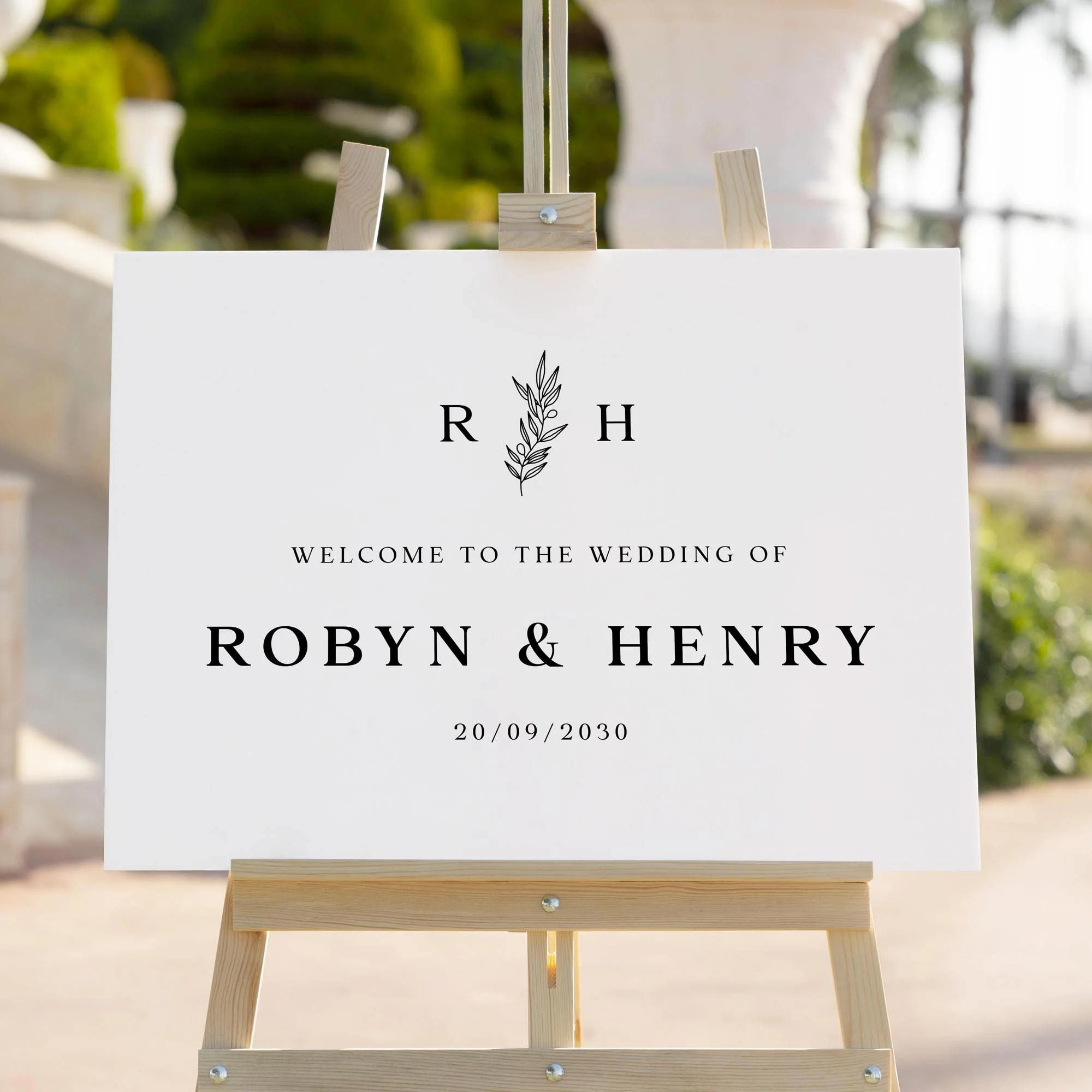 Modern Botanical Monogram wedding welcome sign styled outdoors close-up
