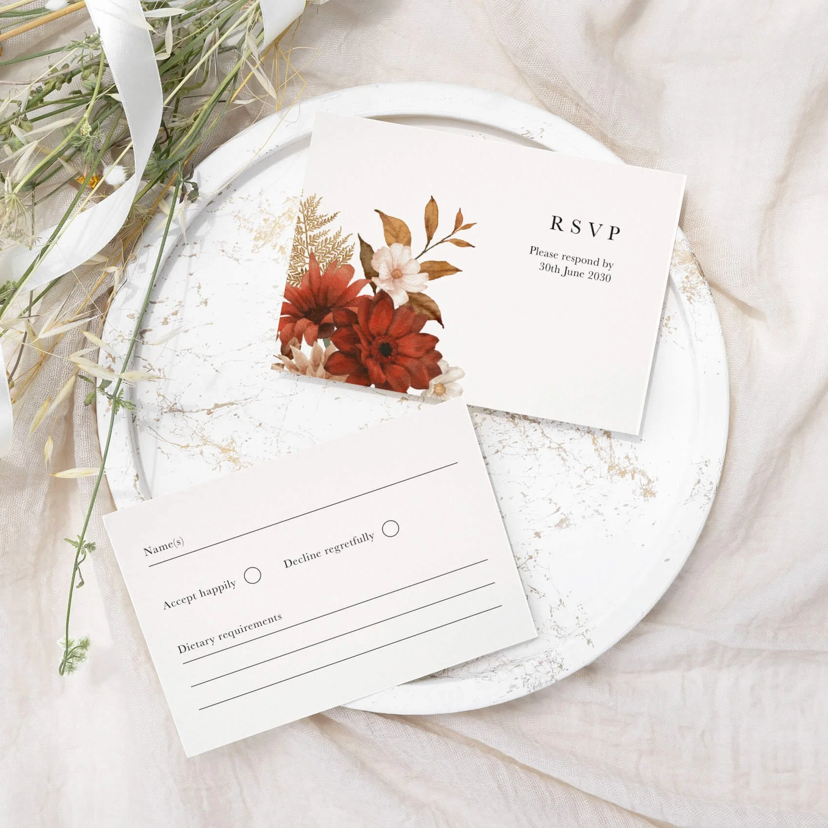 Rustic wedding RSVP card with terracotta and rust watercolour dried botanical arrangement on luxury off-white card