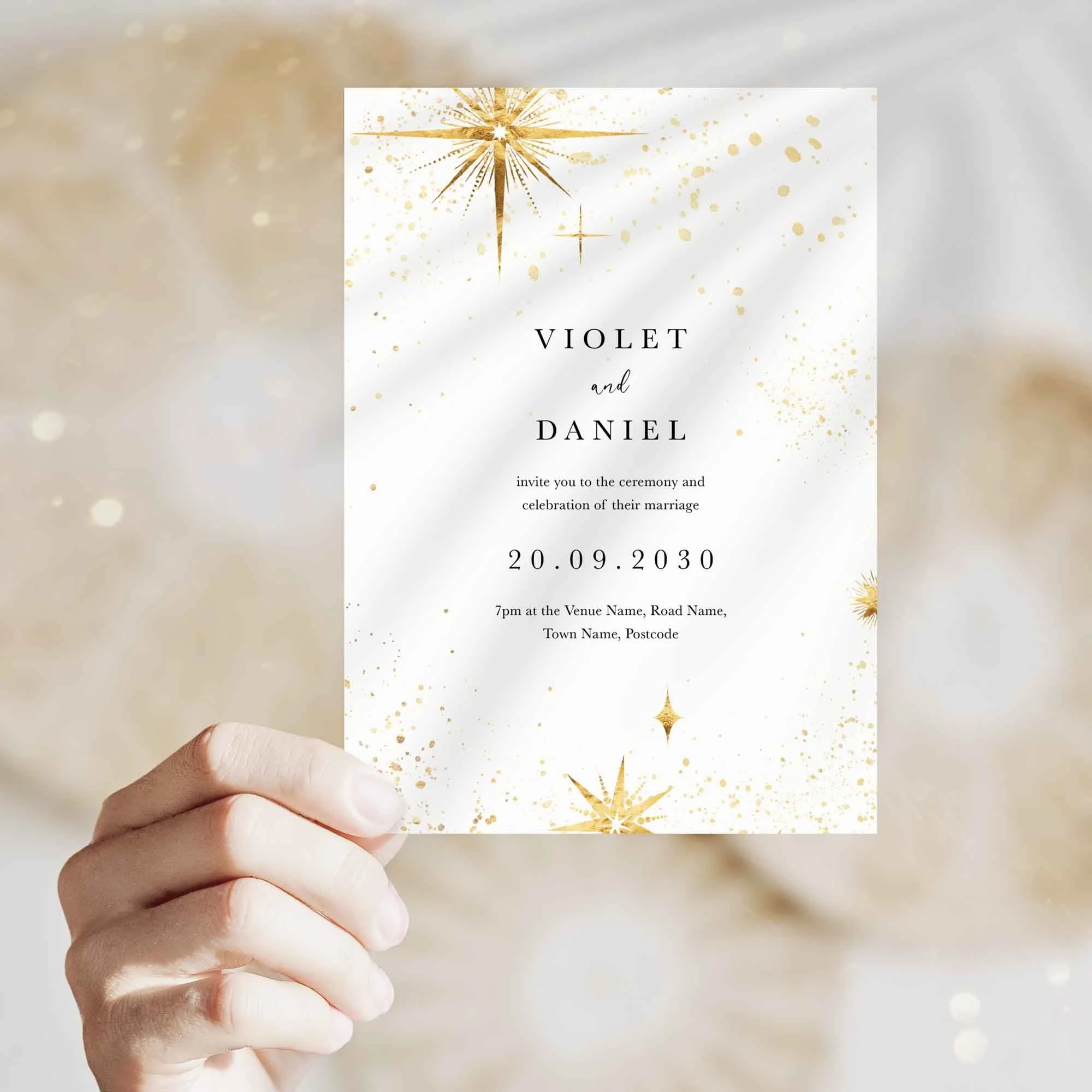 Hand holding Celestial wedding invitation showing size and printed design details