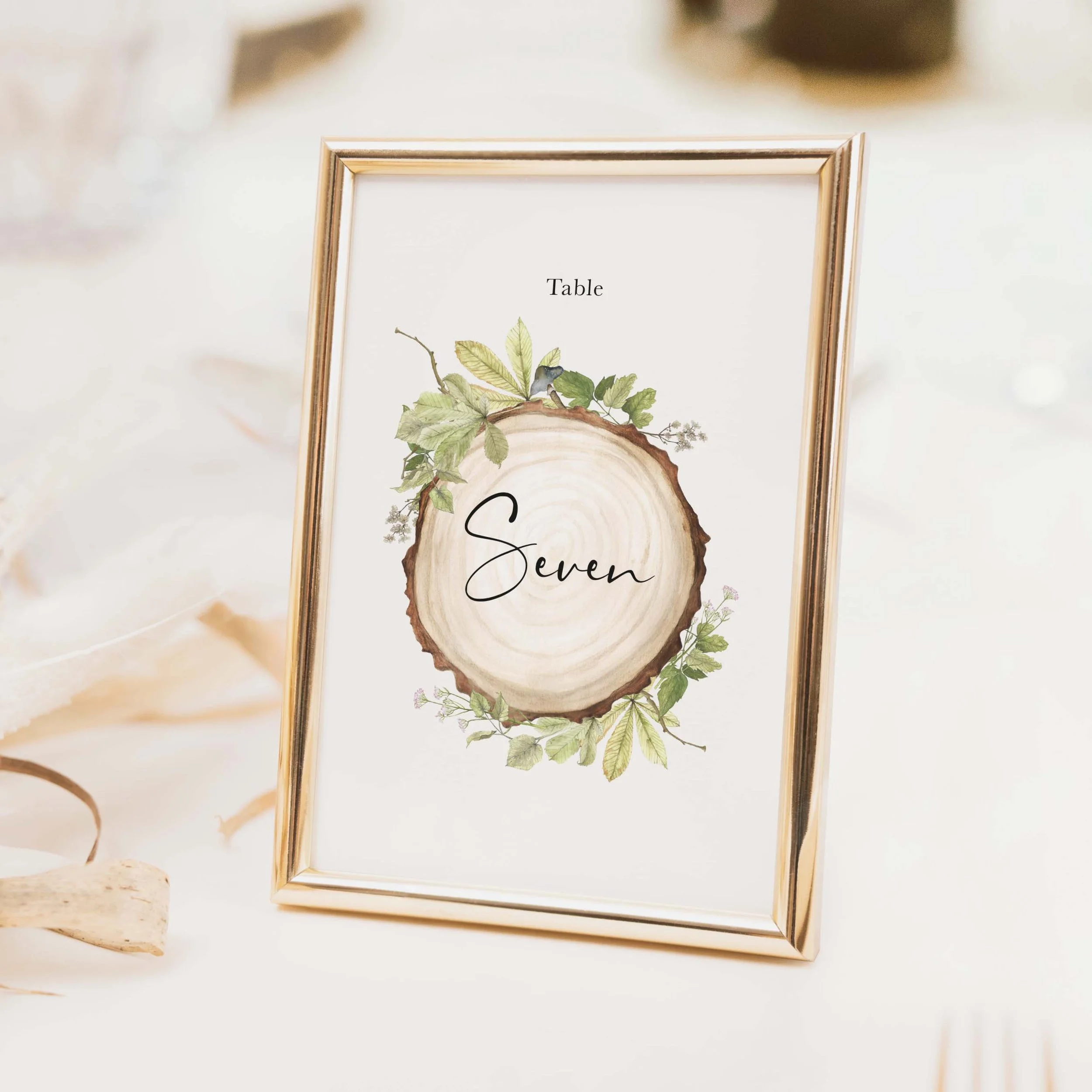 Wood Slice wedding table number with illustrated tree ring wood slice design and flowing calligraphy typography on luxury off-white textured card