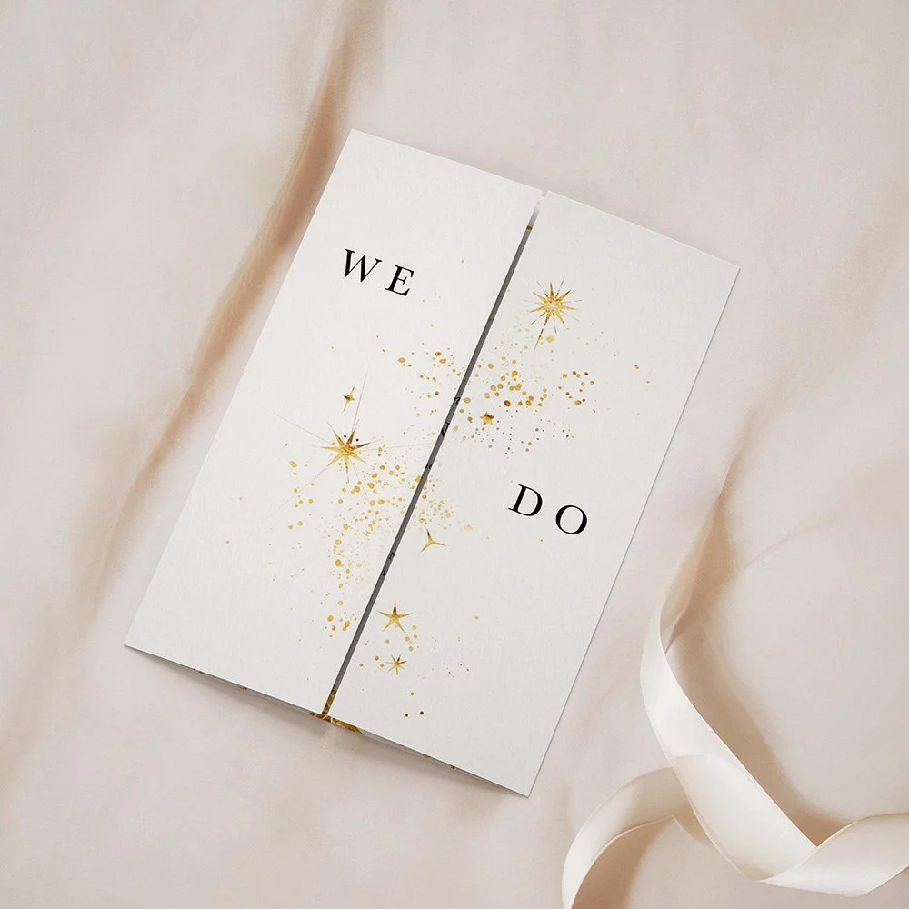 Celestial Collection gatefold wedding invitation closed, featuring gold stars and elegant typography