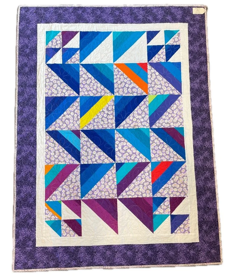 A one of a kind treasure handcrafted quilt by Beryl Taylor;  fits a double size bed.