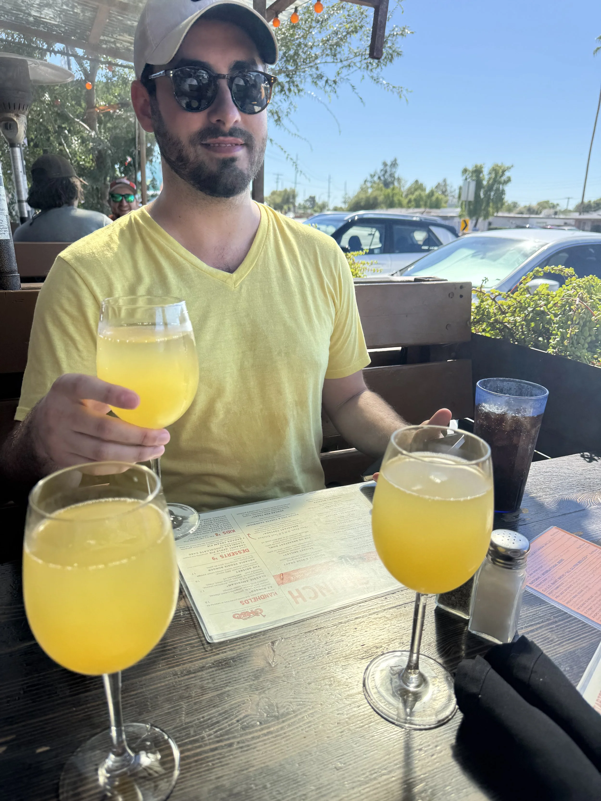 Volunteers from Phoenix Arcadia Rotary Club socializing over drinks at Osho Brewing Company following street cleanup along Indian School Road in Arcadia