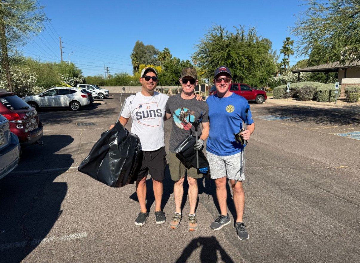 Phoenix Arcadia Rotary Club members cleaning streets along Indian School Road between 44th and 56th Street during Own the Street Day in Arcadia, Phoenix