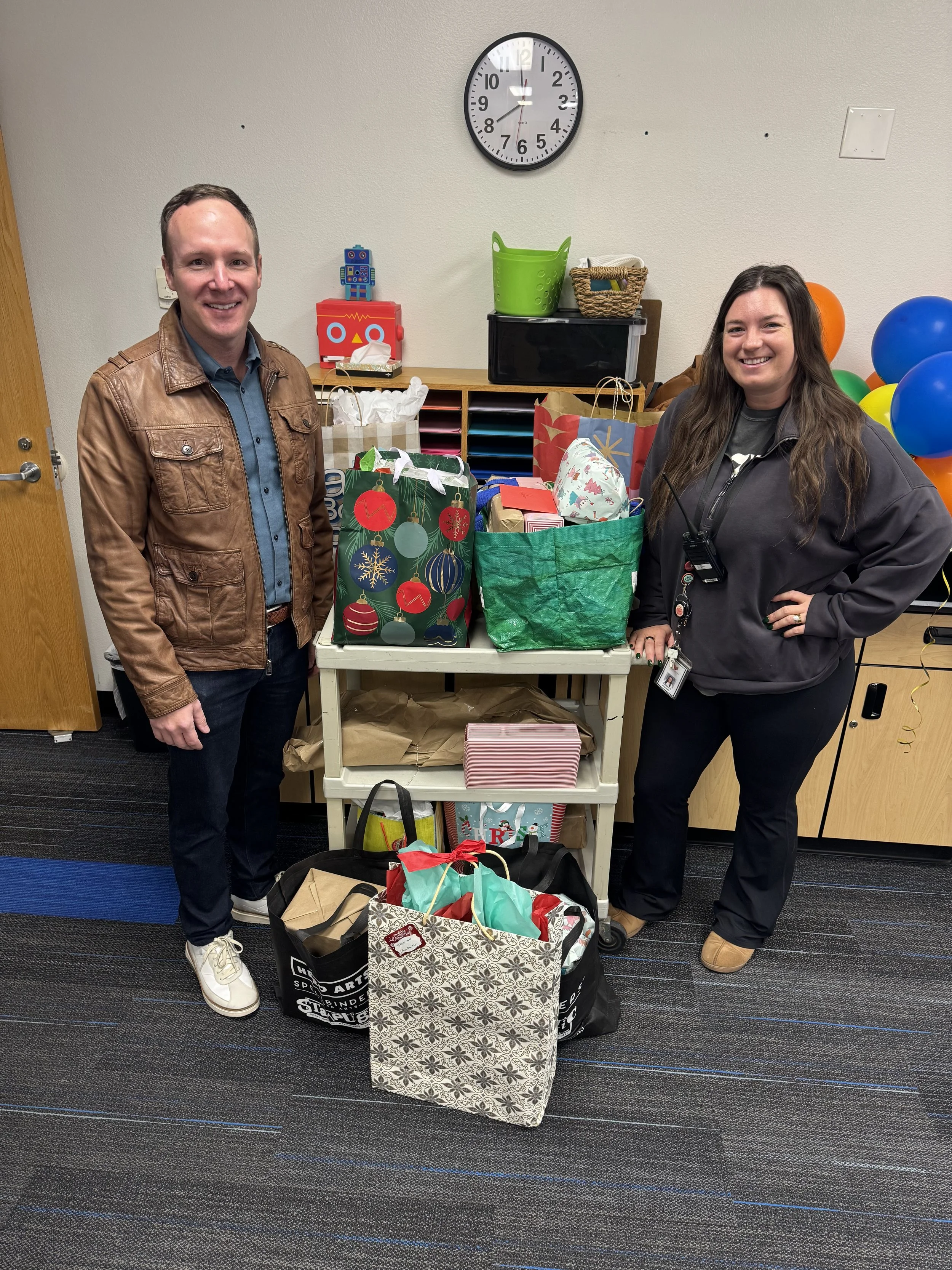 Phoenix Arcadia Rotary Club members, along with Matt Gress, donated holiday gifts to a foster family in Phoenix, Arizona, supporting five children and making a meaningful impact in the community.