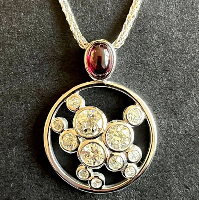 14k white gold, diamonds, and cabochon ruby