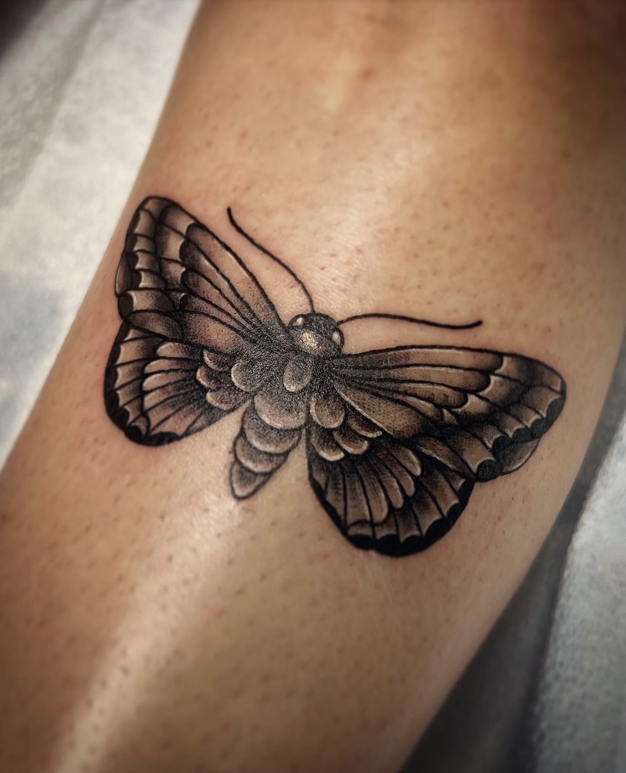 Custom black and gray butterfly tattoo