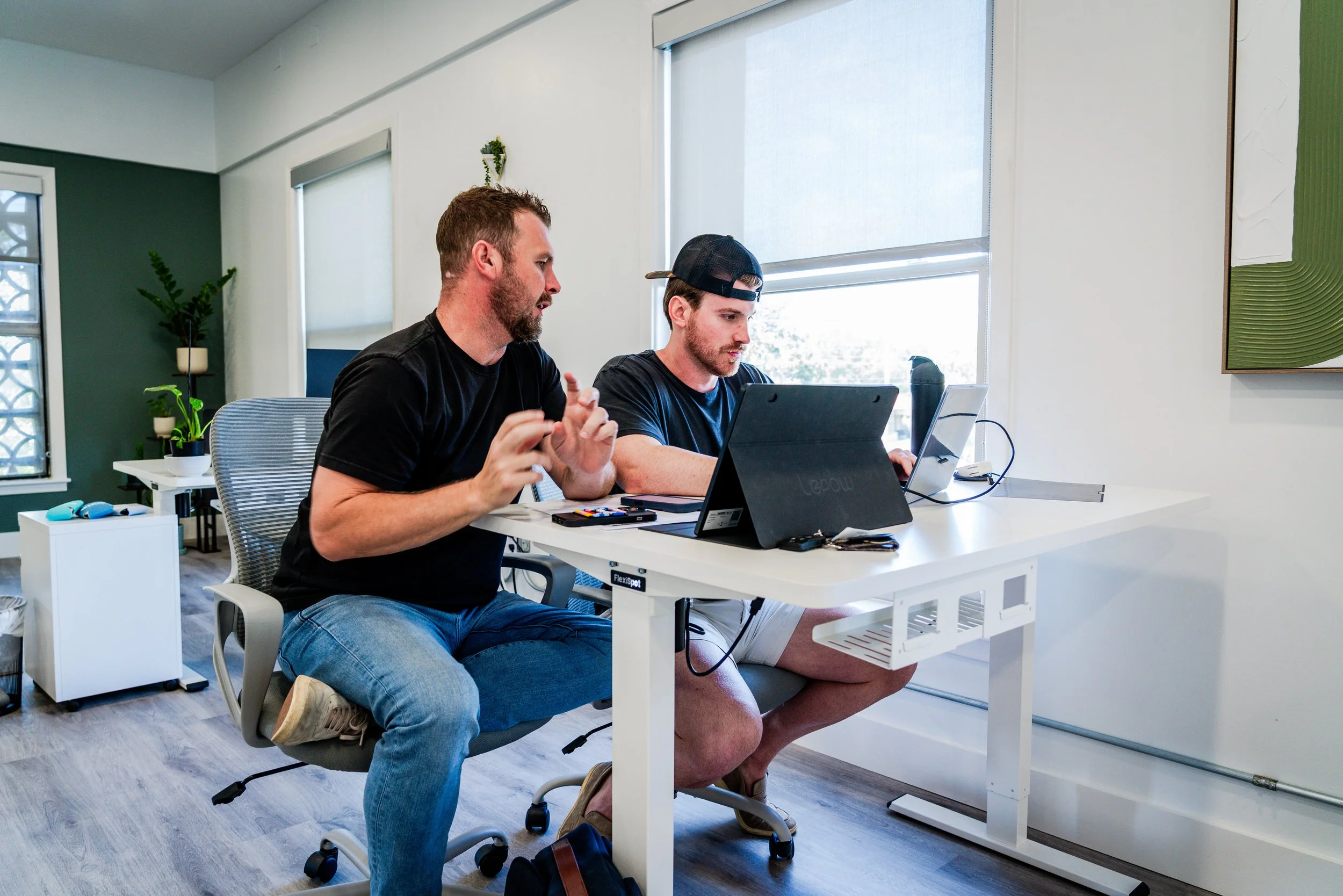 Image 2 employees discussing new design trends