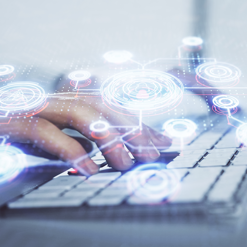 A person typing on a keyboard with a digital overlay of interconnected circular icons and lines, suggesting technology or digital networking.