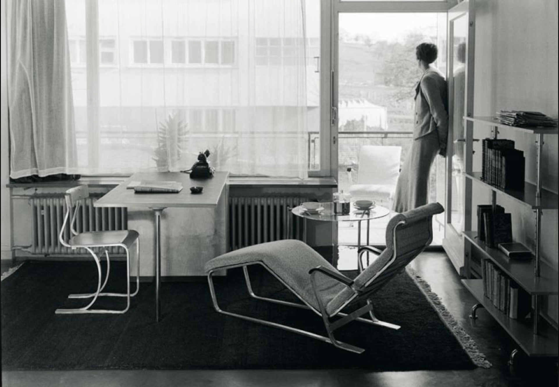Black-and-white photograph of a modernist Bauhaus interior with tubular-metal chairs, illustrating the shift toward industrial materials and functional furniture design in the 1920s.
