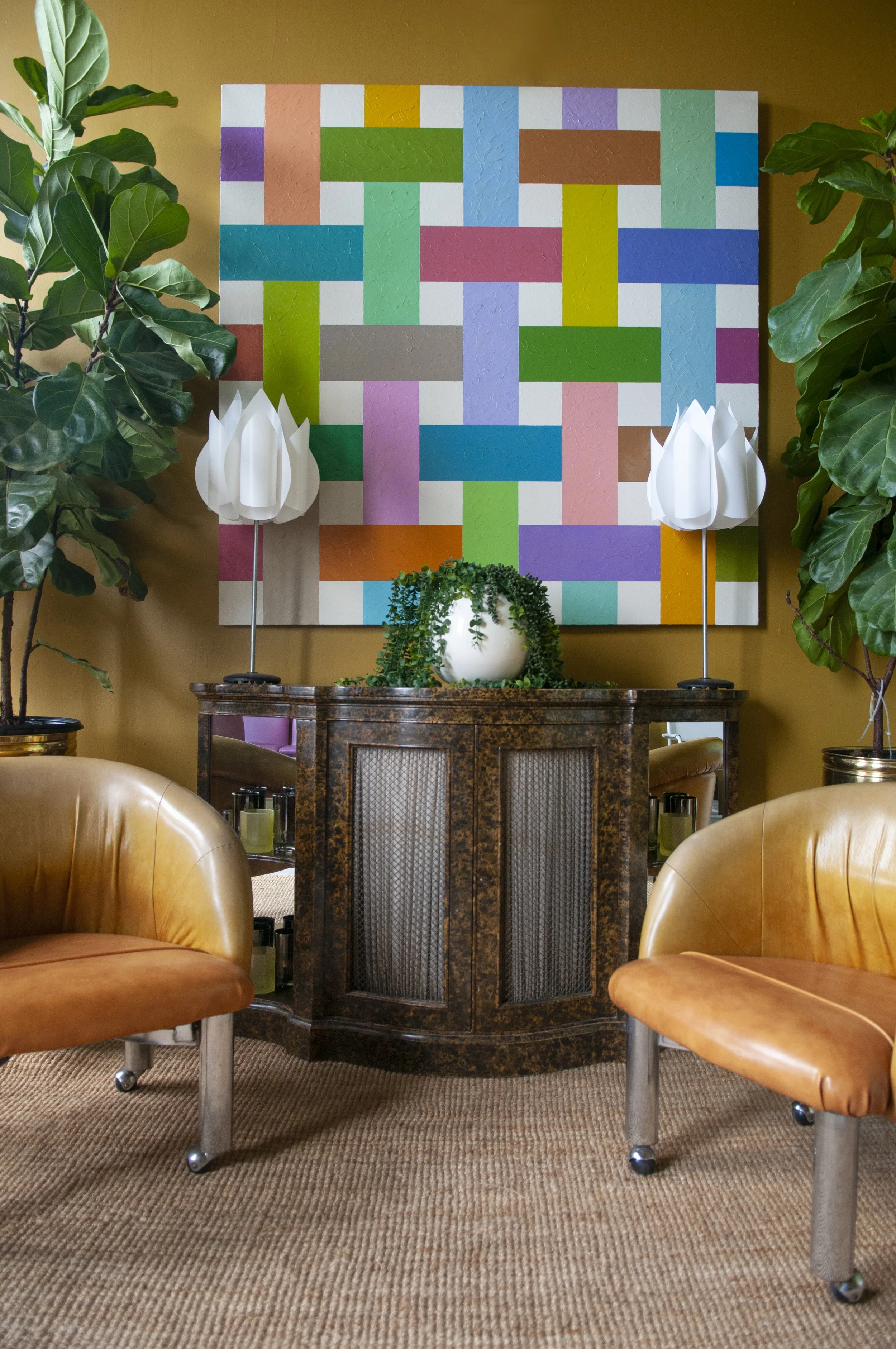 House of No Era's former historic loft studio in Camp Washington, Cincinnati, featuring a pair of 2008 IKEA Knappa Tulpan lamps by Flemming Brylle and Preben Jacobsen, Milo Baughman lounge chairs on casters, a large Mastercraft-style demi-lune cabine
