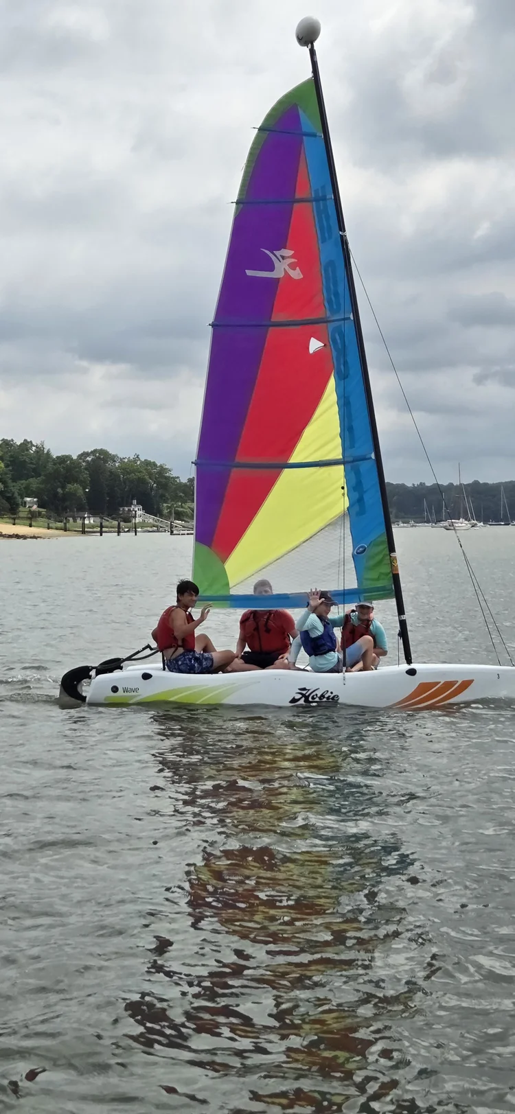 Sailors participating in a WaterFront Center sailing program