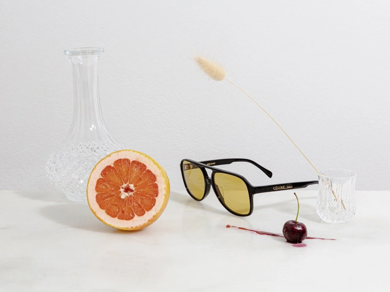 Vintage crystal decanter and glass, Céline sunglasses