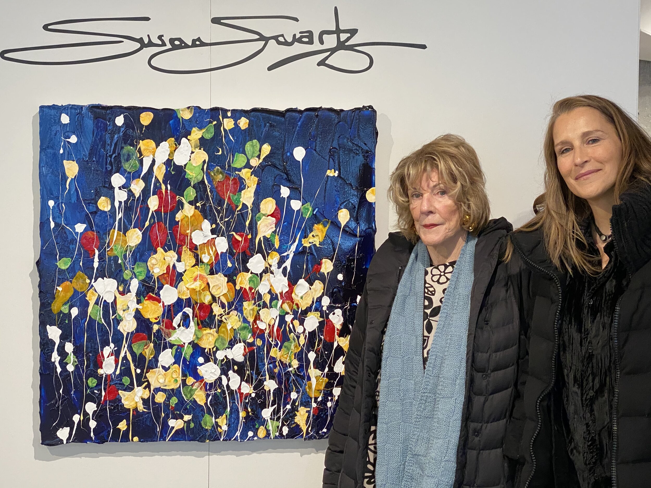 Agnes Gund and Cat Gund stand alongside "Nature's Bouquet 11" by Susan Swartz