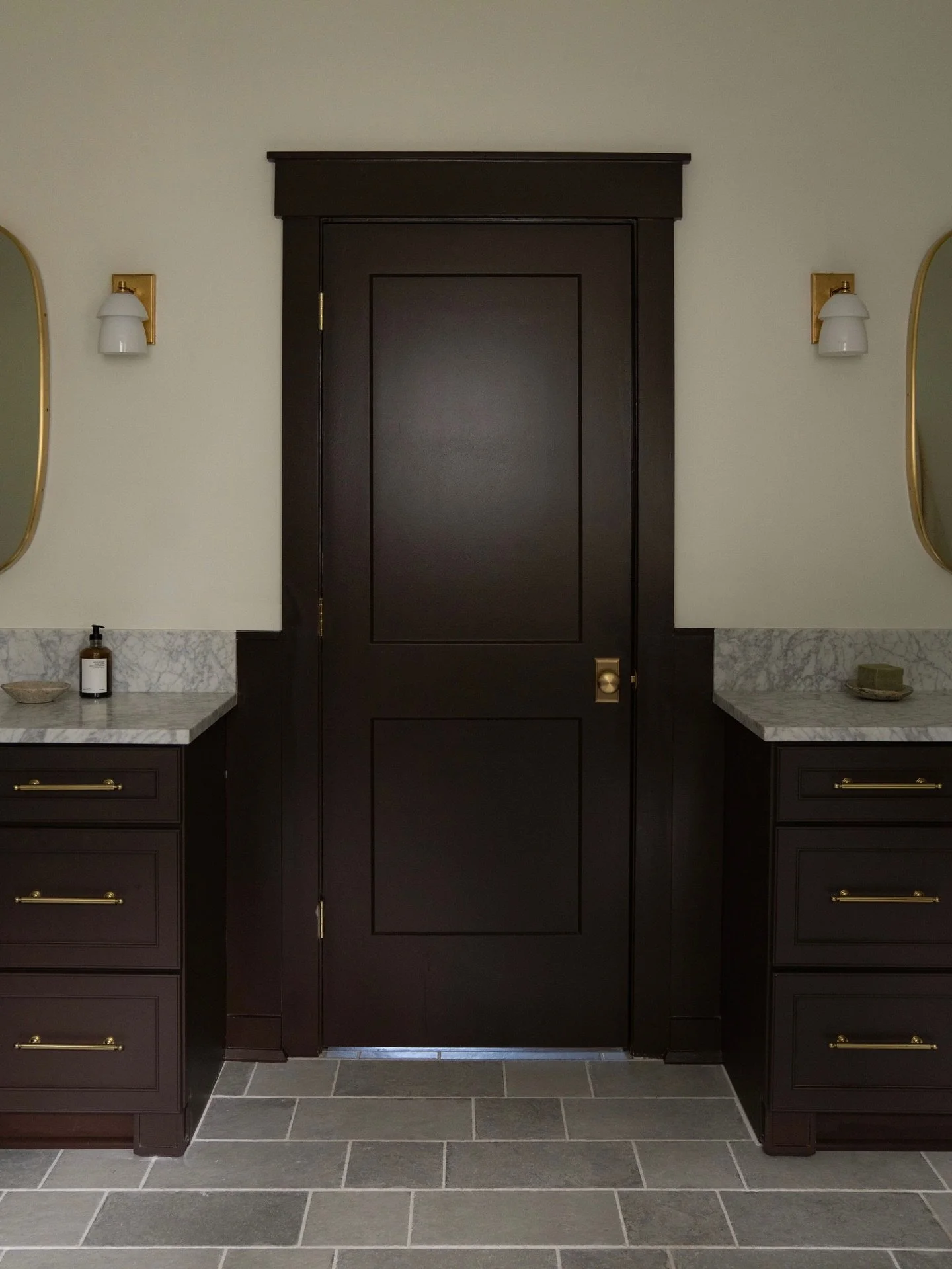 Welcome to Cresthill Ave, our newly completed interior remodel here in Atlanta! 

Next up, we'd like to introduce you to the primary bathroom! Dual vanities provide ample space for daily routines, while the shower was designed to feel expansive- comp