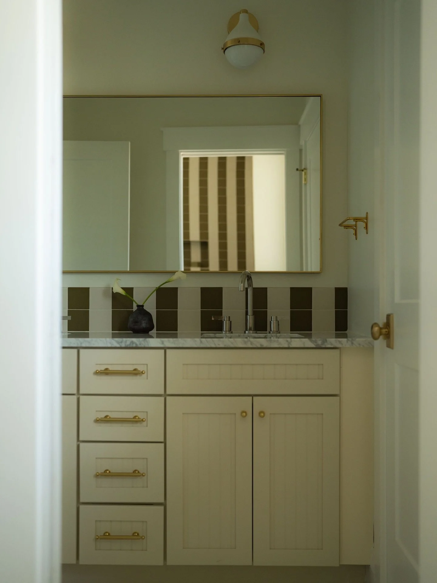 Welcome to Cresthill Ave, our newly completed interior remodel here in Atlanta! 

For the kids&rsquo; bathroom, we aimed to keep it cohesive with the rest of the home while introducing a playful, youthful touch. Striped tile envelopes the shower and 