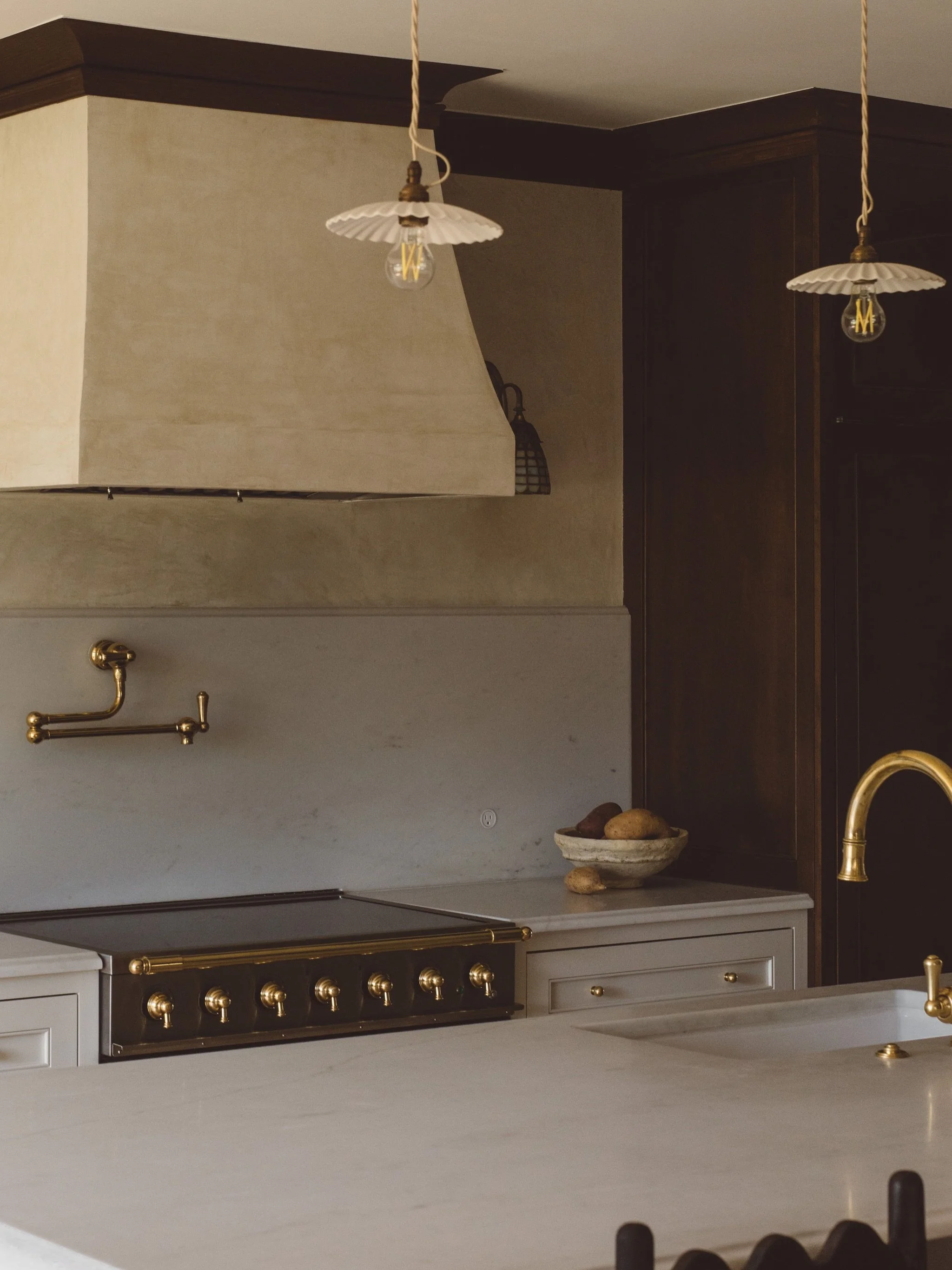 Not us realizing this kitchen hasn&rsquo;t gotten the attention it deserves. So, here are a few more perspectives!

To honor the home&rsquo;s original millwork, we carried the geometry of the arched leaded-glass window into the refrigerator column an