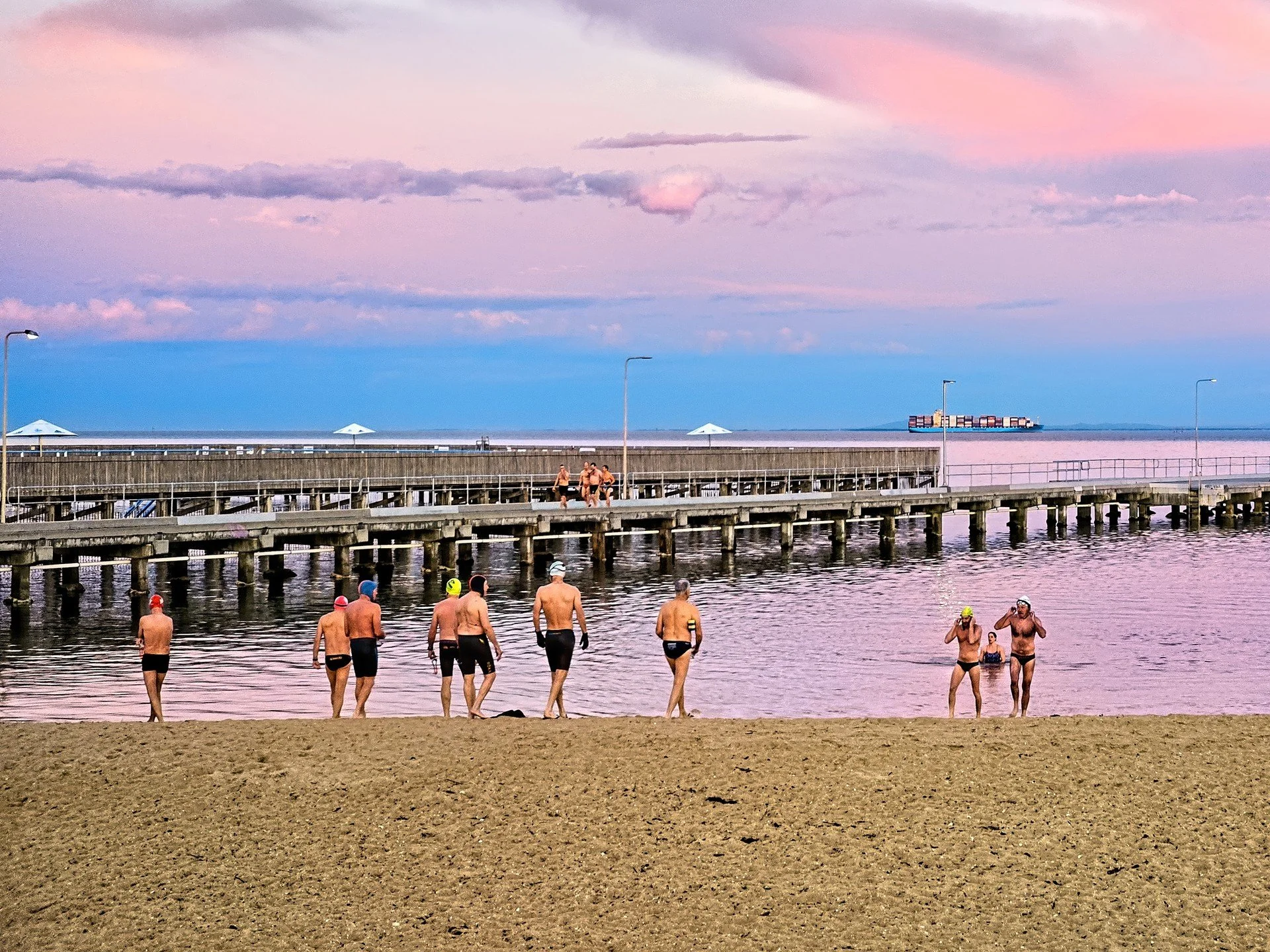 A waking sky with pastel hues,
Chatting friends, many crews,
No coldy bites, just pure delight, 
Just I see, a cool calm sea, 
A cold embrace, a graceful place.
08-15 07:11 sea=12.0c air=10.3c wind speed=0 wind gusts=0 direction=CALM
https://ozswims.