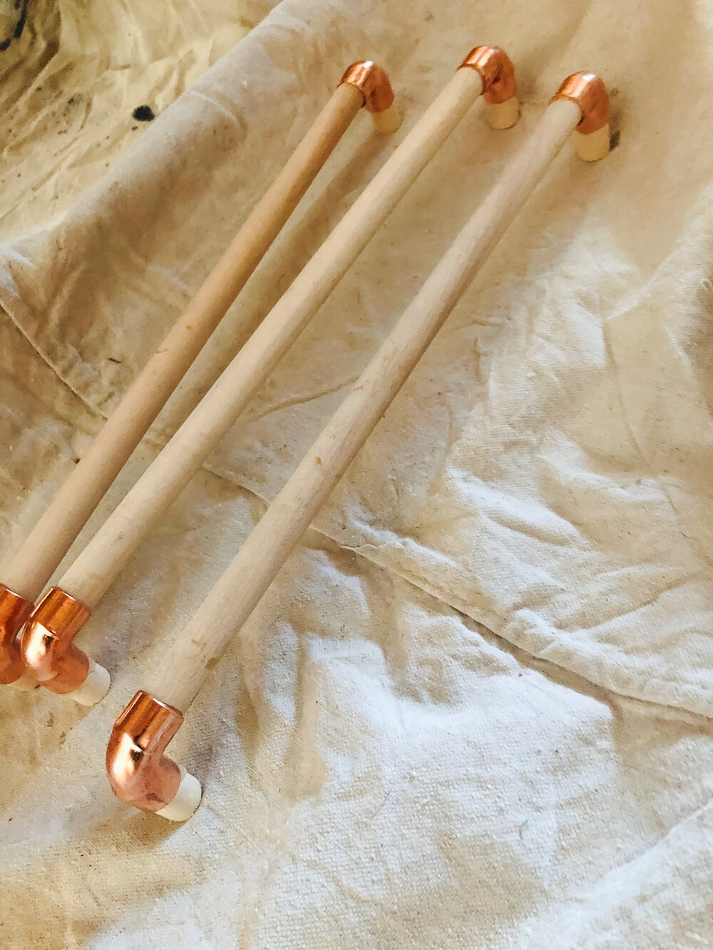 Cut dowels to size and install in copper elbows with epoxy.