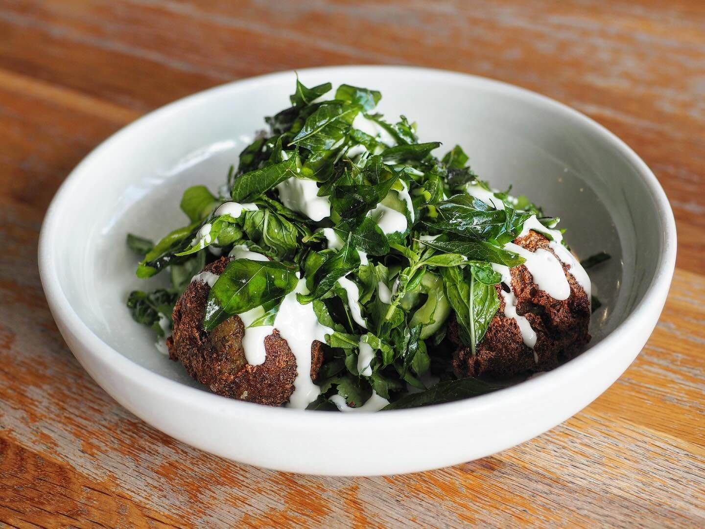 &bull; Indian potato fritters, cucumber &amp; herb salad, garlic yoghurt &bull; 

Our new fritters at the cafe, available on our all day breakfast menu.