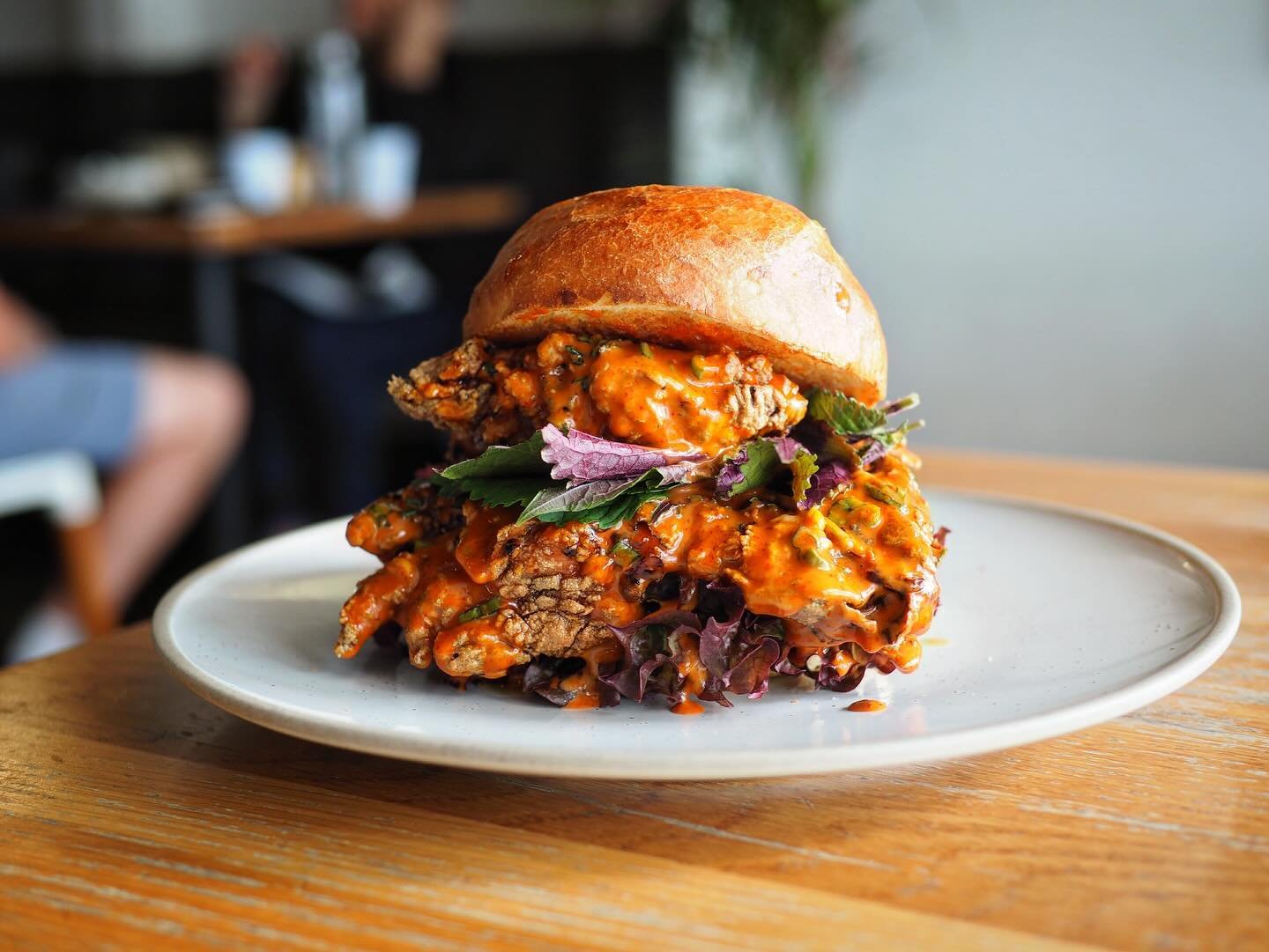 &bull; our cafes got a new fried chicken burger on! 
 with gochujang sauce, lettuce and shiso &bull; 

#cafe #burger #jervisbay #shoalhaven