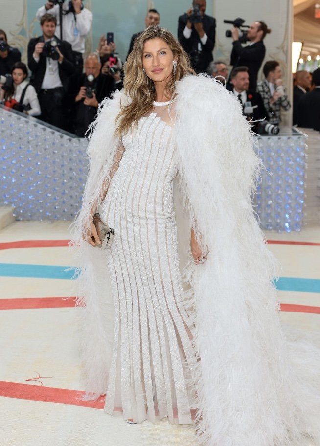 Cara Delevingne Wears High-Low Dress and Leg Gloves at 2023 Met Gala