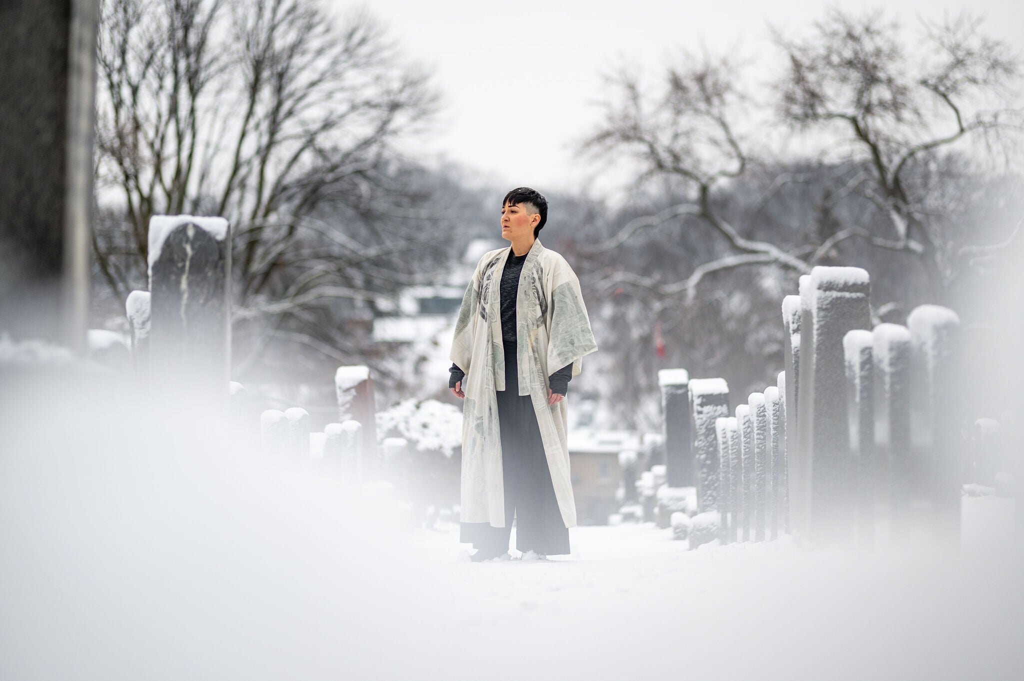  “Soprano  Teiya Kasahara ’s ethereal arrangement of “He was despised,” for example, is performed in a snow-covered graveyard, with  Kasahara  walking among the tombstones while singing in English, their own voice providing a circular supporting harm