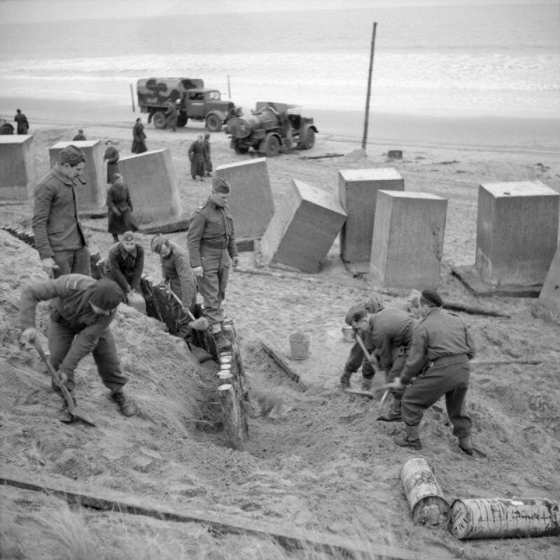 Building anti-tank defences on a British beach, 1940