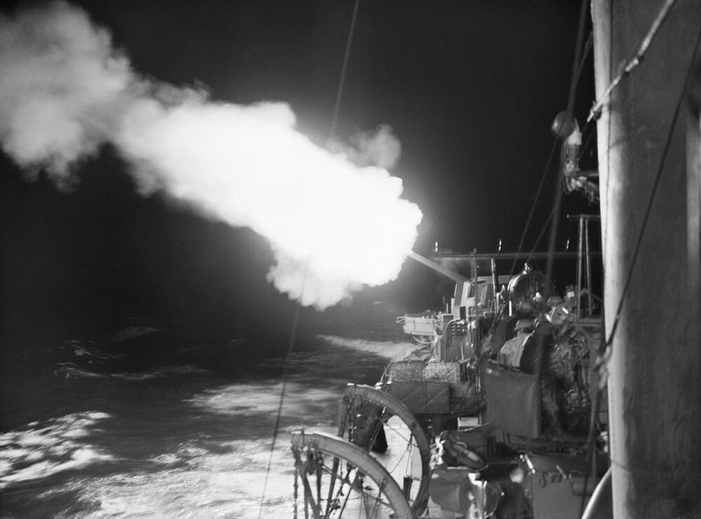 HMS Jupiter firing on enemy shipping, port of Cherbourg, 10-11 October 1940