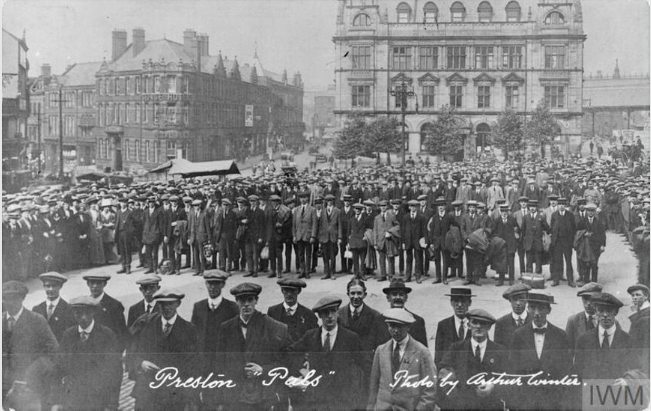 Volunteer recruits of the 'Preston Pals' parade in their civilian clothes in Market Square, Preston, on 7 September 1914, Imperial War Museum, HU53725