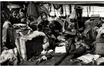 Inughuit women sewing clothes for Peary expedition on board SS Roosevelt